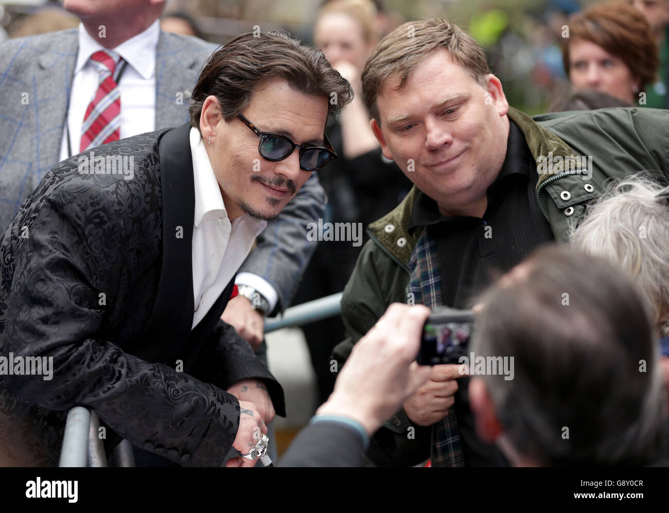 Johnny Depp poses for photographs with fans whilst attending the Alice ...