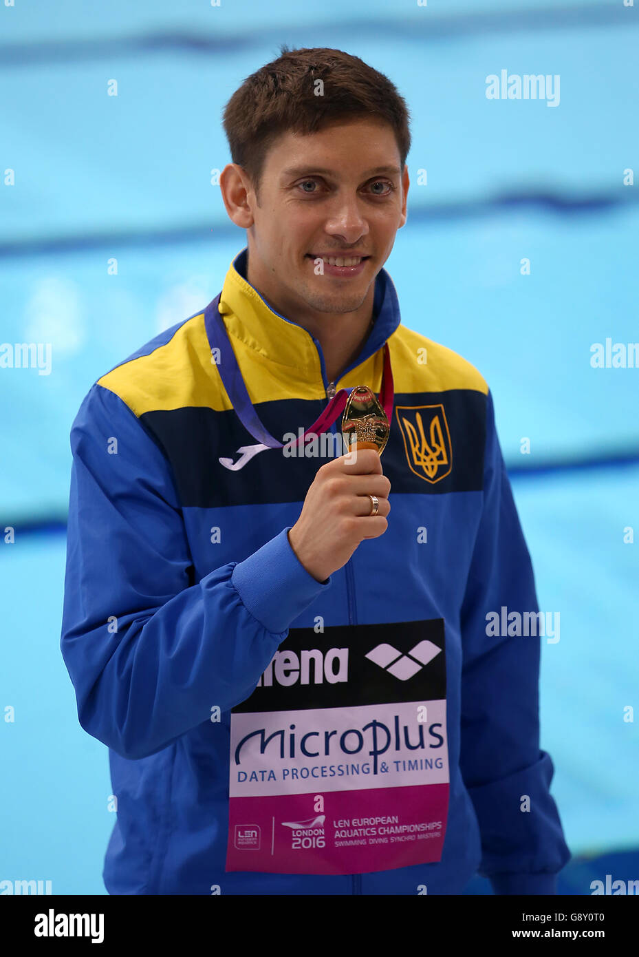 Ukraine's Illya Kasha poses with his medal after winning gold in the