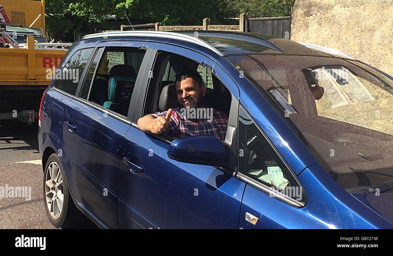 Ghazi Hassan, back in his car which was rescued after it was swallowed up by a sinkhole in south-east London, as he has said he is 'thankful' his family were not hurt in the 'crazy' incident. Stock Photo