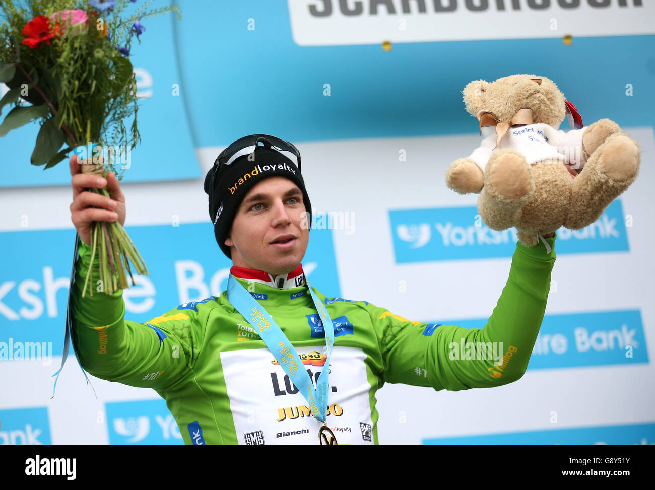 Team Lotto NL-Jumbo's Dylan Groenewegen with the green jersey on the podium after stage three of the Tour de Yorkshire. Stock Photo