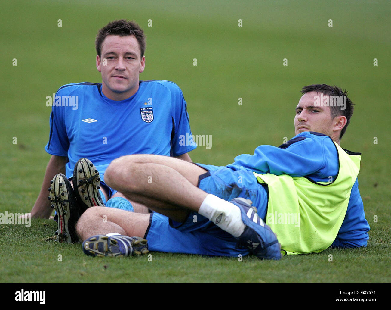 England and Chelsea team-mates John Terry (L) and Frank Lampard take a break during a training session at Carrington Training Ground, Manchester, Tuesday October 4, 2005. England play Austria in their World Cup qualifying match on Saturday. PRESS ASSOCIATION Photo. Photo credit should read: Martin Rickett/PA. Stock Photo