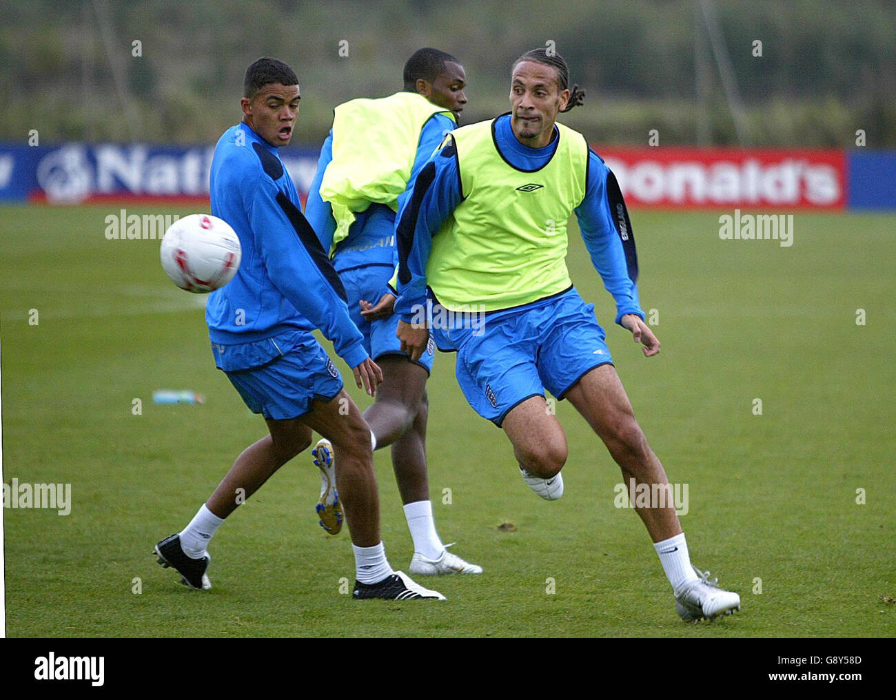 England's Rio Ferdinand (R) gets past team-mate Jermaine Jenas (L) during a training session at Carrington Training Ground, Manchester, Tuesday October 4, 2005. England play Austria in their World Cup qualifying match on Saturday. PRESS ASSOCIATION Photo. Photo credit should read: Martin Rickett/PA. Stock Photo