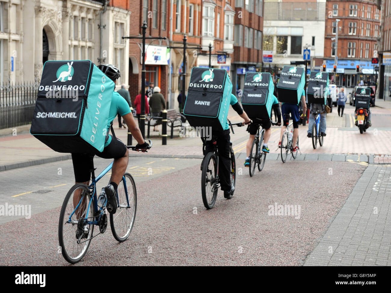A team of Deliveroo riders named after Leicester City FC players sets off from Peter Pizzeria in Leicester to deliver freebies to football fans in celebration of the club winning the Barclays Premier League, ahead of the team lifting the trophy this weekend. Stock Photo