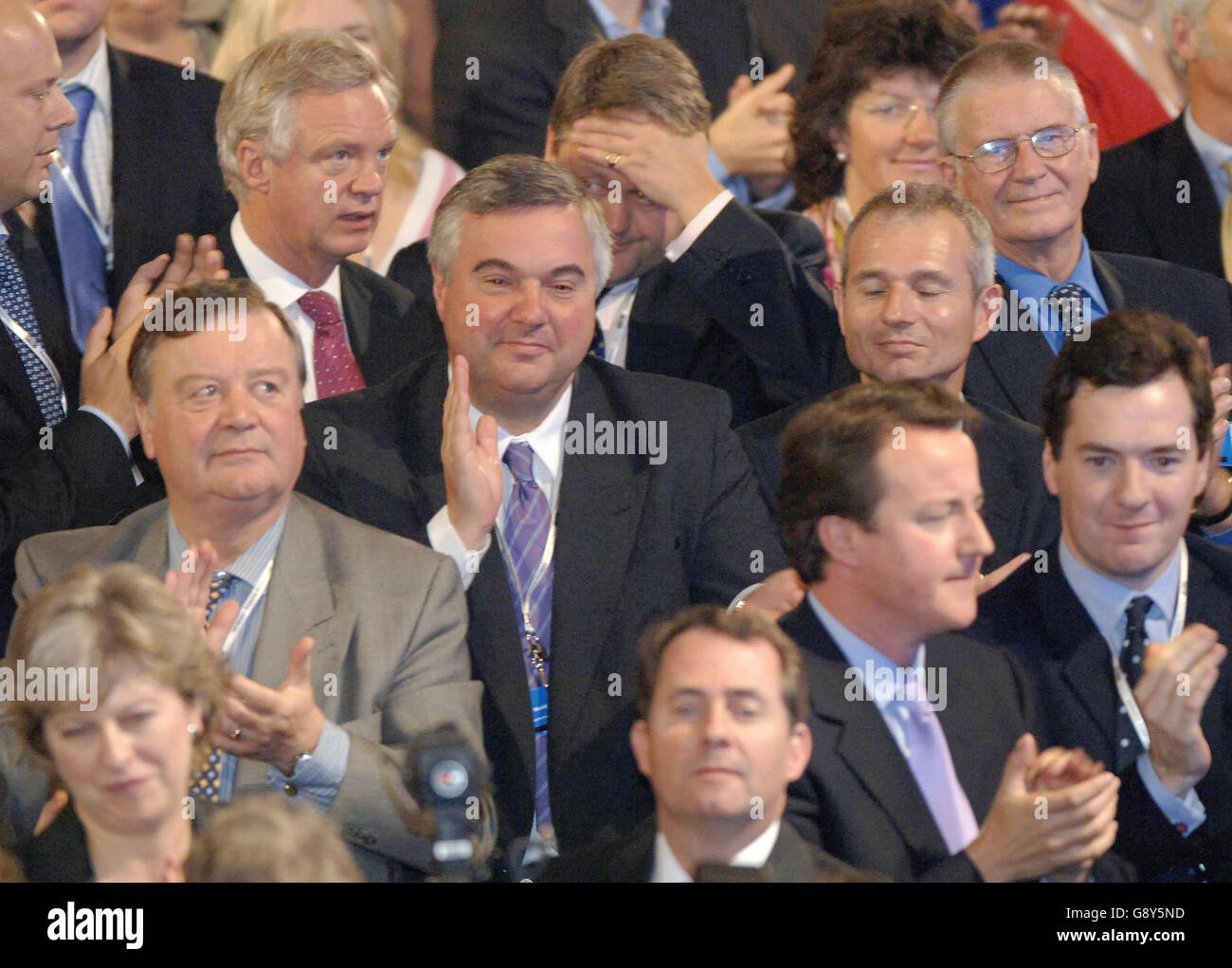 David Davis(back) Ken Clarke(left) and David Cameron(right) and next to him is Liam Fox applaud Michael Howard as he makes his farewell speech to the Conservative Conference in Blackpool today Thursday 6th October 2005. See PA STory TORY LEAD PRESS ASSOCIATION PHOTO .PHOTO CREDIT SHOULD READ JOHN GILES/PA Stock Photo