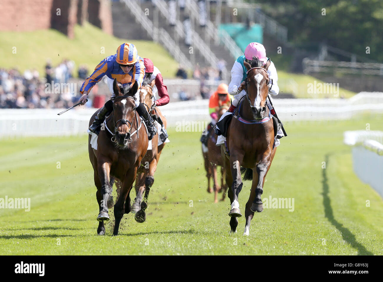 Somehow ridden by Ryan Moore (left) wins The Arkle Finance Cheshire Oaks ahead of Moorside ridden by Darryll Holland (right) during Betway Chester Cup Day of the Boodles May Festival at Chester Racecourse. Stock Photo