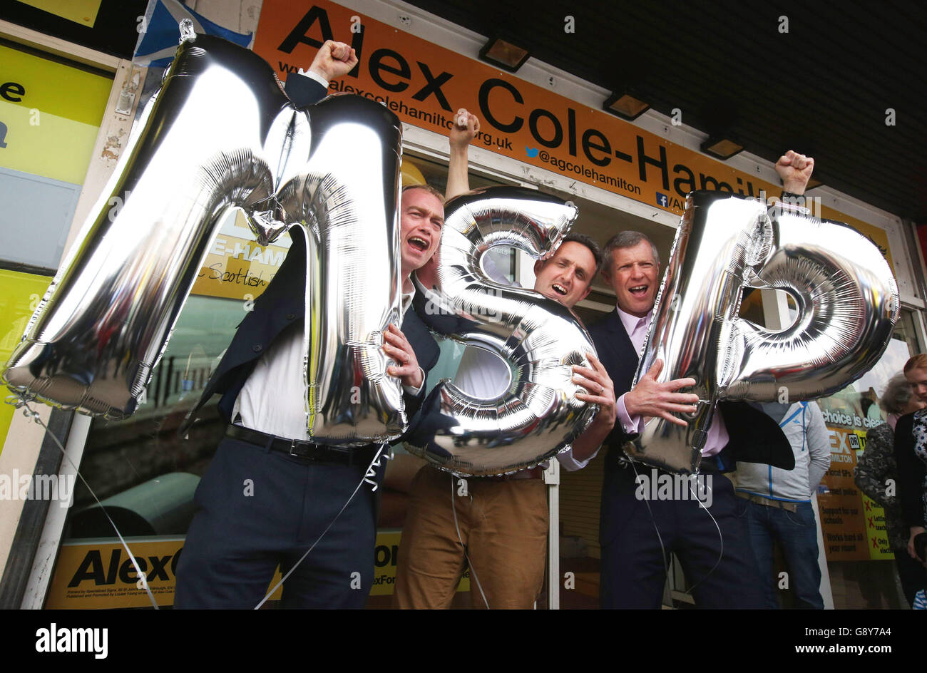 (left to right) Liberal Democrat leader Tim Farron, Lib Dem Alex Cole-Hamilton and Scottish Liberal Democrat leader Wiilie Rennie, as they celebrate in Edinburgh, after Rennie and Cole-Hamilton both won their seats in the Scottish parliamentary elections. Stock Photo