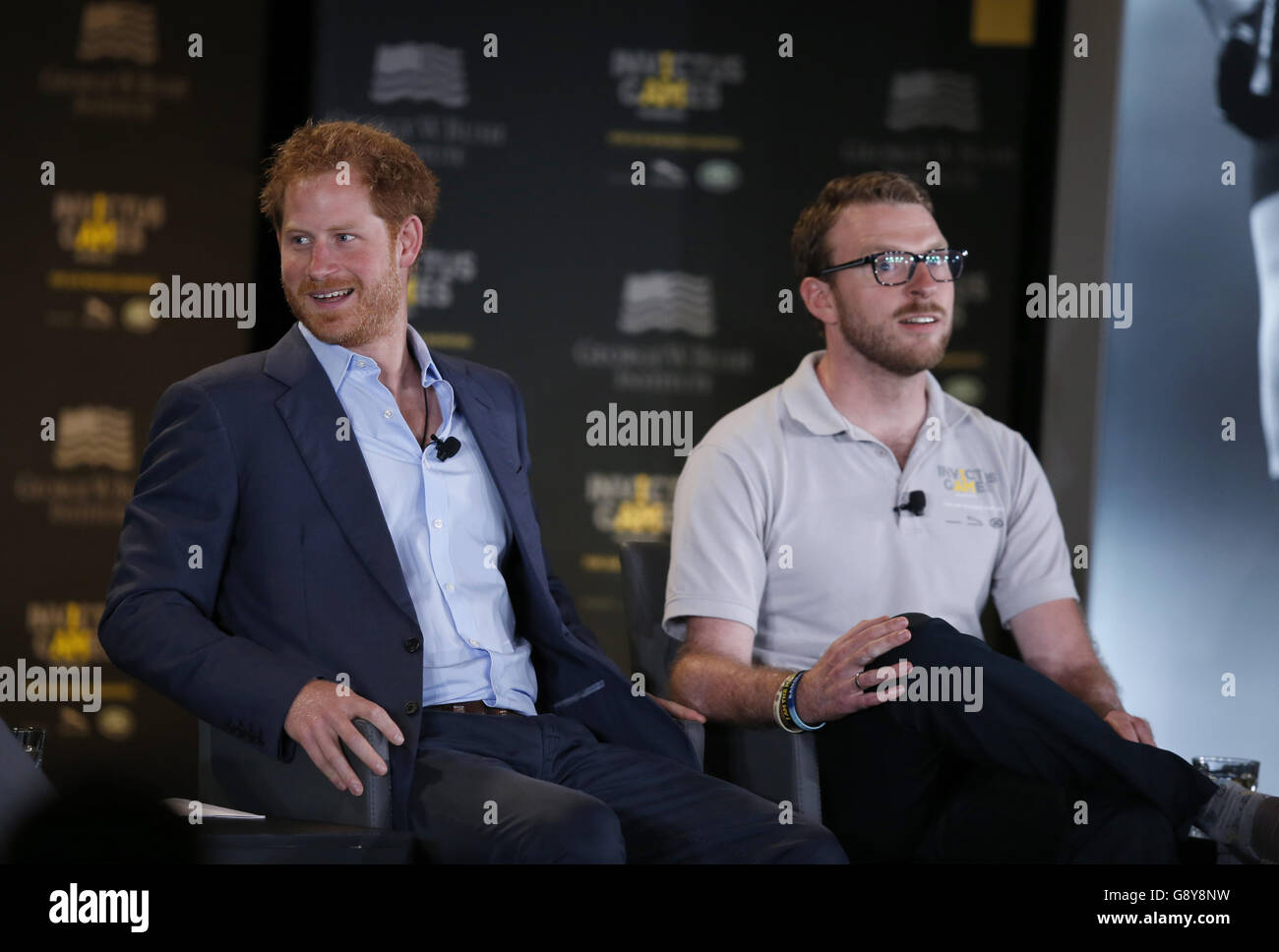 Prince Harry (left) attends the Symposium on Invisible Wounds presented by the George W. Bush Institute, as part of the Invictus Games, at Shades of Green Hotel in Orlando, Florida. Stock Photo