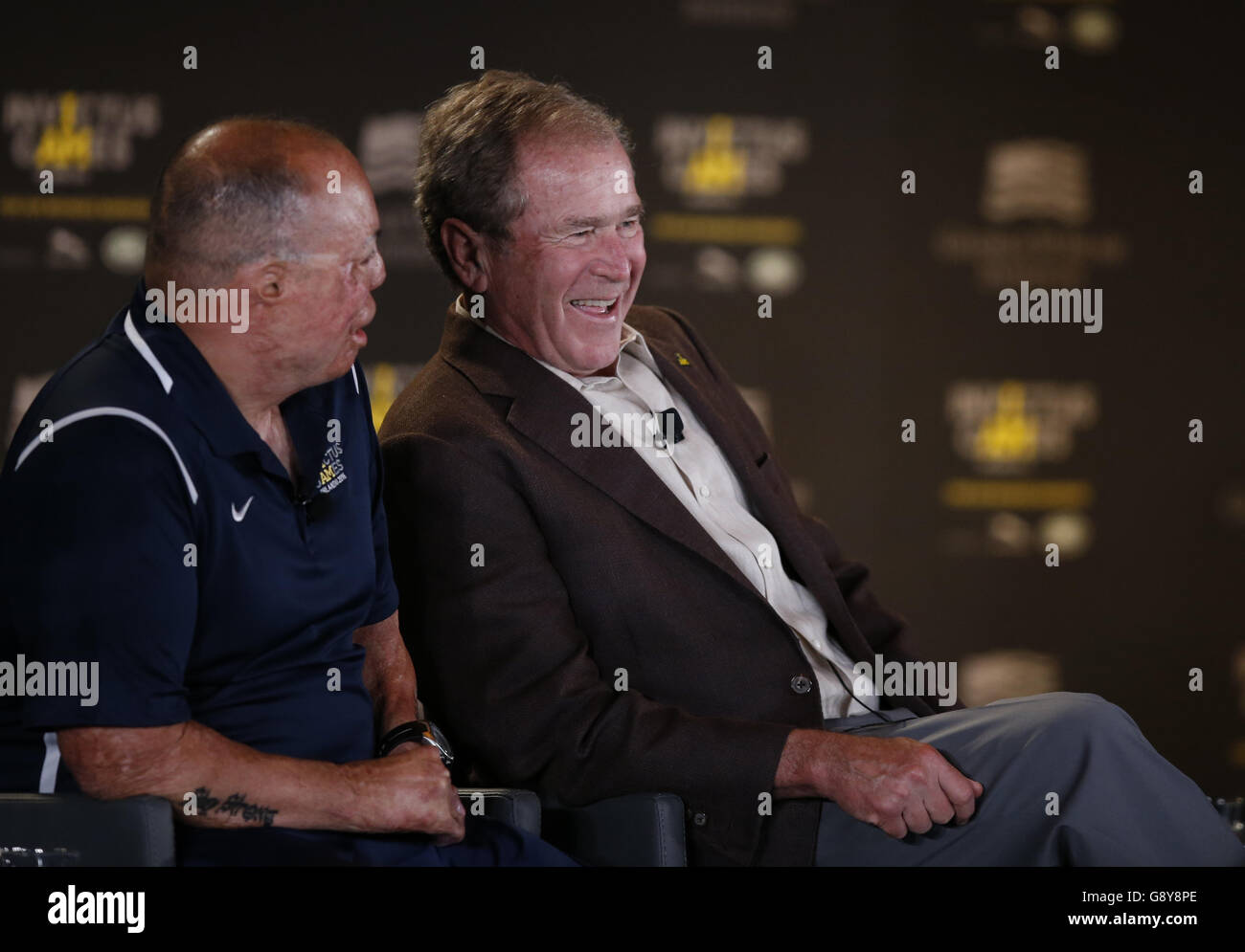 Former US President George W Bush (centre) attends the Symposium on Invisible Wounds presented by the George W. Bush Institute, as part of the Invictus Games, at Shades of Green Hotel in Orlando, Florida. Stock Photo