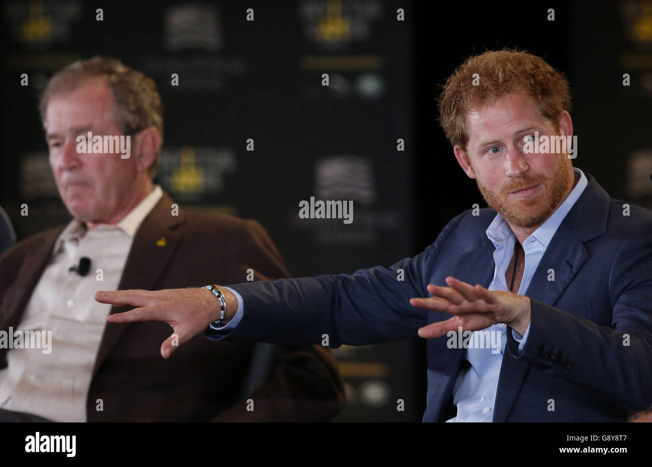 Prince Harry (right) and former US President George W Bush attend the Symposium on Invisible Wounds presented by the George W. Bush Institute, as part of the Invictus Games, at Shades of Green Hotel in Orlando, Florida. Stock Photo