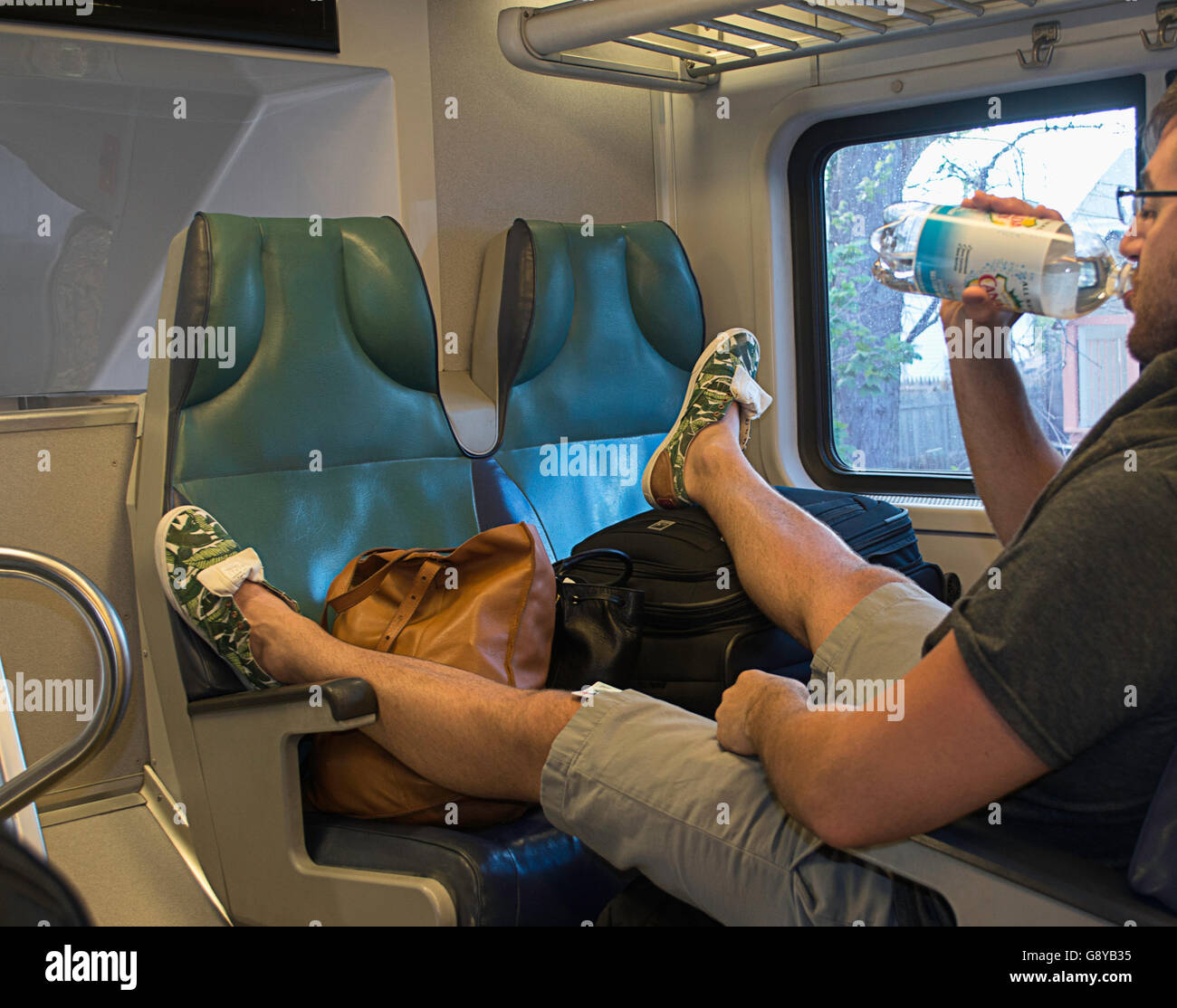 Feet on train seat hires stock photography and images Alamy