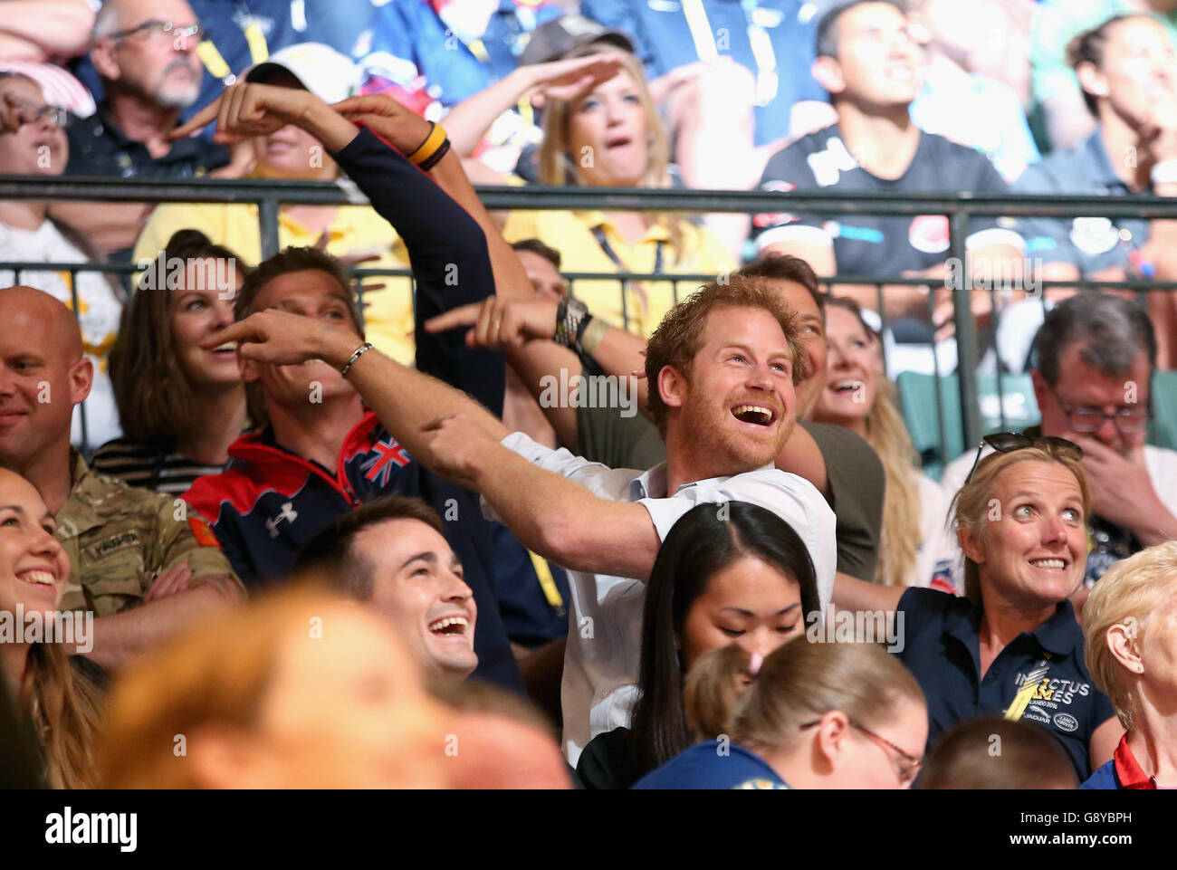 Prince Harry is caught on 'Salute Cam' during the GBR Vs Australia wheelchair rugby match at the Invictus Games Orlando 2016 at ESPN Wide World of Sports in Orlando, Florida. Stock Photo