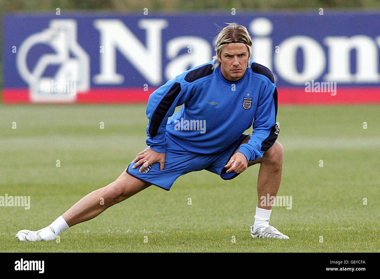 England's David Beckham stretches during a training session at Carrington, Manchester, Tuesday October 11, 2005, ahead of their World Cup qualifying match against Poland tomorrow evening. PRESS ASSOCIATION Photo. Photo credit should read: Martin Rickett/PA. Stock Photo