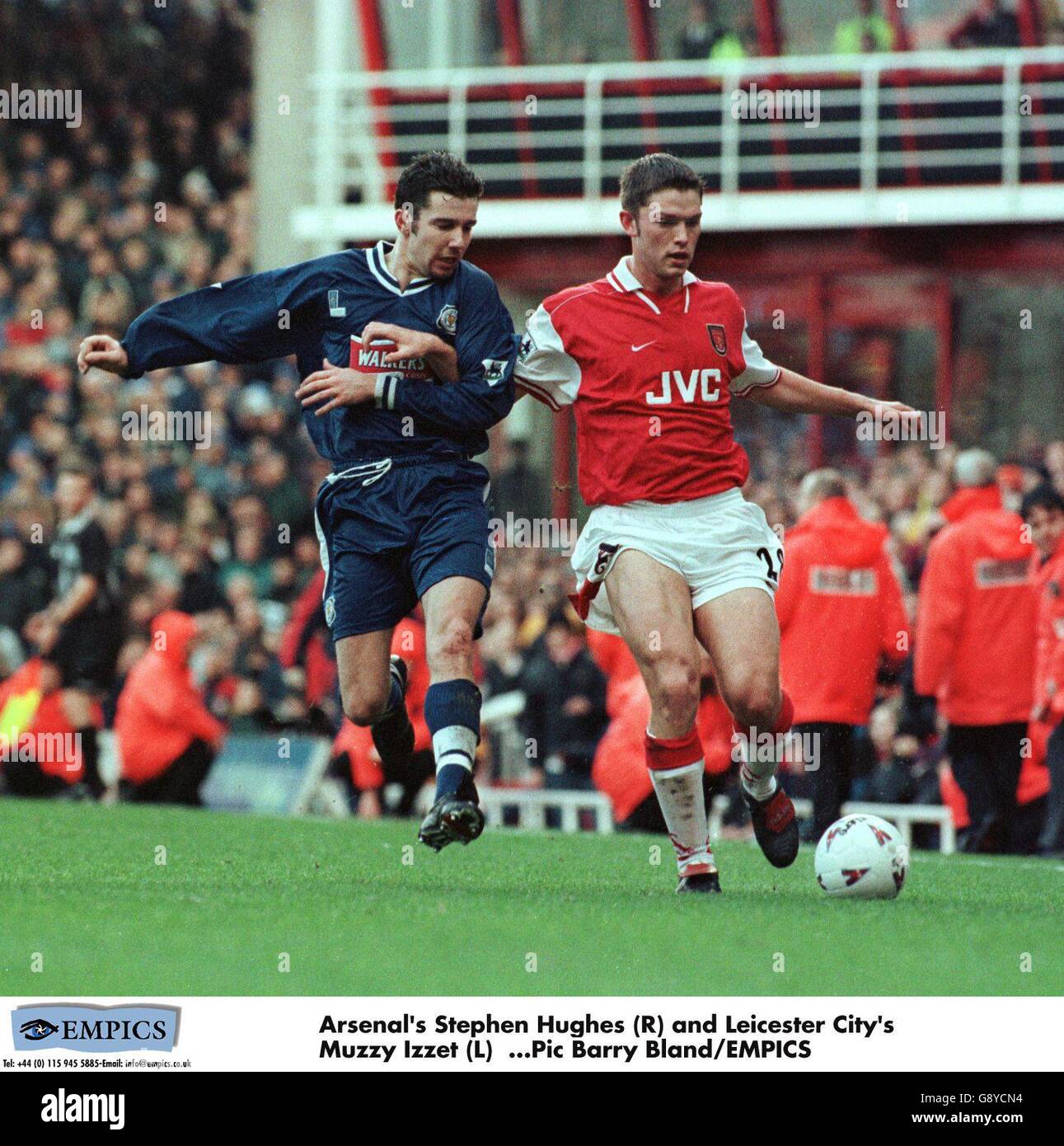 Arsenal's Stephen Hughes (right) tries to get past Leicester City's Mustafa Izzet (left) Stock Photo