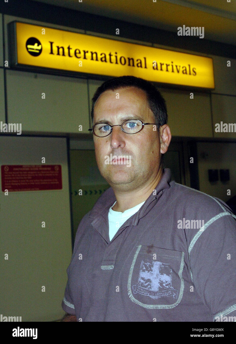 Passenger David Lowe, 41, from Cumbernauld arrives at Glasgow airport Tuesday, October 25, 2005. after returning from Florida and surviving hurricane Wilma . See PA Story SCOTLAND Hurricane. PRESS ASSOCIATION PHOTO PHOTO CREDIT SHOULD READ Danny Lawson/PA Stock Photo