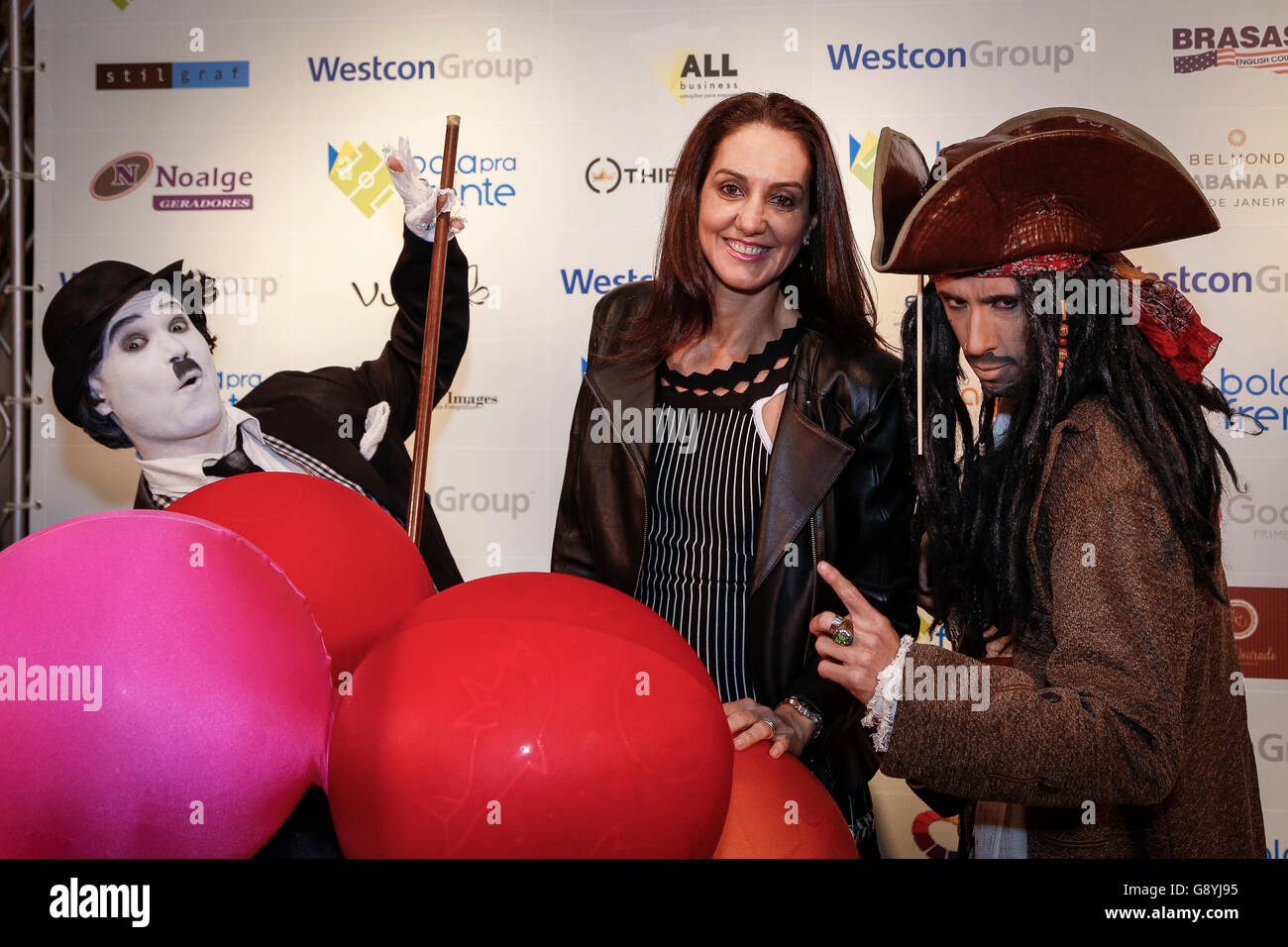 RIO DE JANEIRO, Brazil - 06/29/2016: SOLIDARITY DINNER BALL FORWARD - Former volleyball player Fernanda Venturini between Chaplin and Jack Sparrow for Dinner Solidarity held annually with the aim of raising funds for the Institute Bola Pra Frente. (Photo: Andr? Horta / FotoArena) Stock Photo