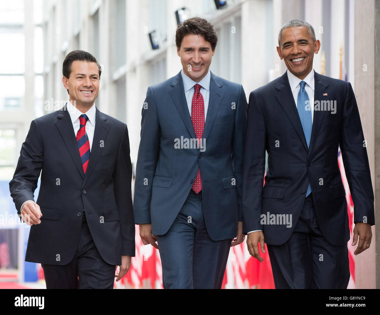 Ottawa, Canada. 29th June, 2016. Canadian Prime Minister Justin Trudeau, center, escorts Mexican President Enrique Pena Nieto, left, and U.S. President Barack Obama during the North American Leaders Summit at the National Gallery of Canada June 29, 2016 in Ottawa, Canada. Credit:  Planetpix/Alamy Live News Stock Photo
