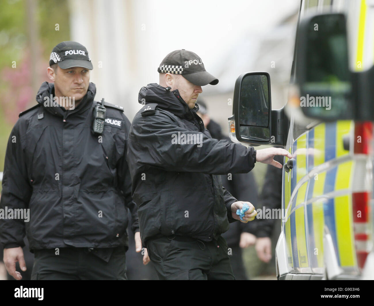 Police officers at the scene on Old Dalkeith Road in Edinburgh where a woman was knocked down and killed by a car being chased by police. Stock Photo