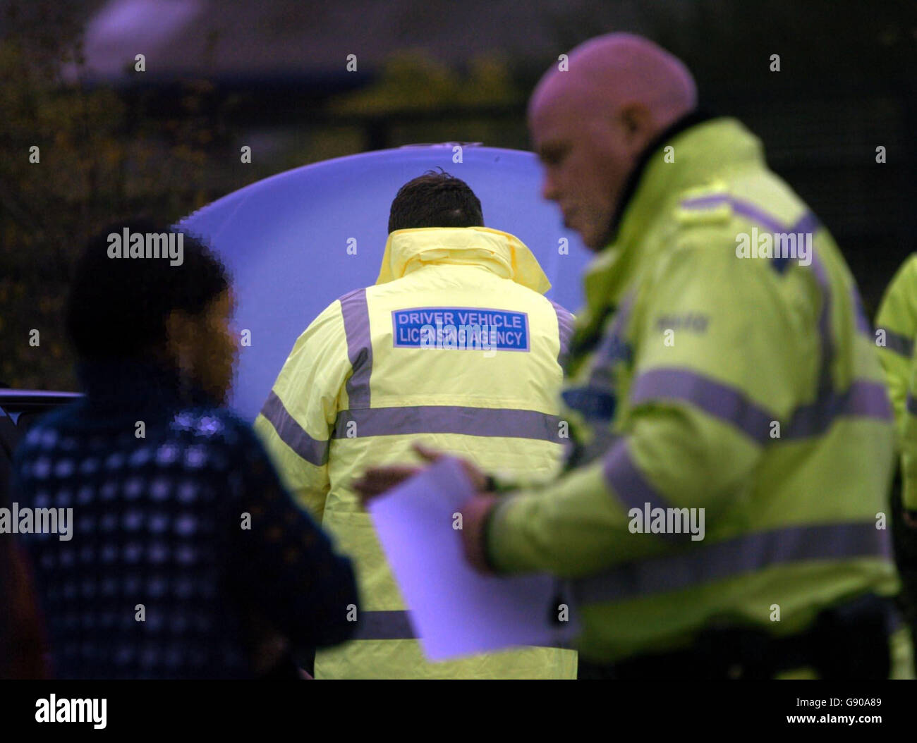 Police caution the driver of an uninsured car during a crackdown on uninsured drivers in Birmingham, Tuesday November 8, 2005. Tough measures to crack down on uninsured drivers were unveiled today by Transport Secretary Alistair Darling. From today, police forces across the country can use automatic number plate recognition cameras to spot and ultimately seize and destroy cars being driven without insurance. The cameras are linked to a database which contains details of all vehicles registered in the UK which are believed to be uninsured. Mr Darling was in Birmingham to see West Midlands Stock Photo