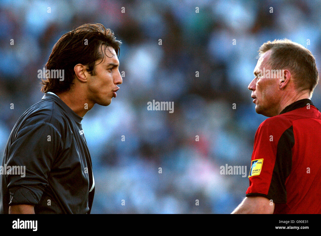 Uruguay goalkeeper Fabian Carini argues with referee Claus Bo Larsen Stock Photo