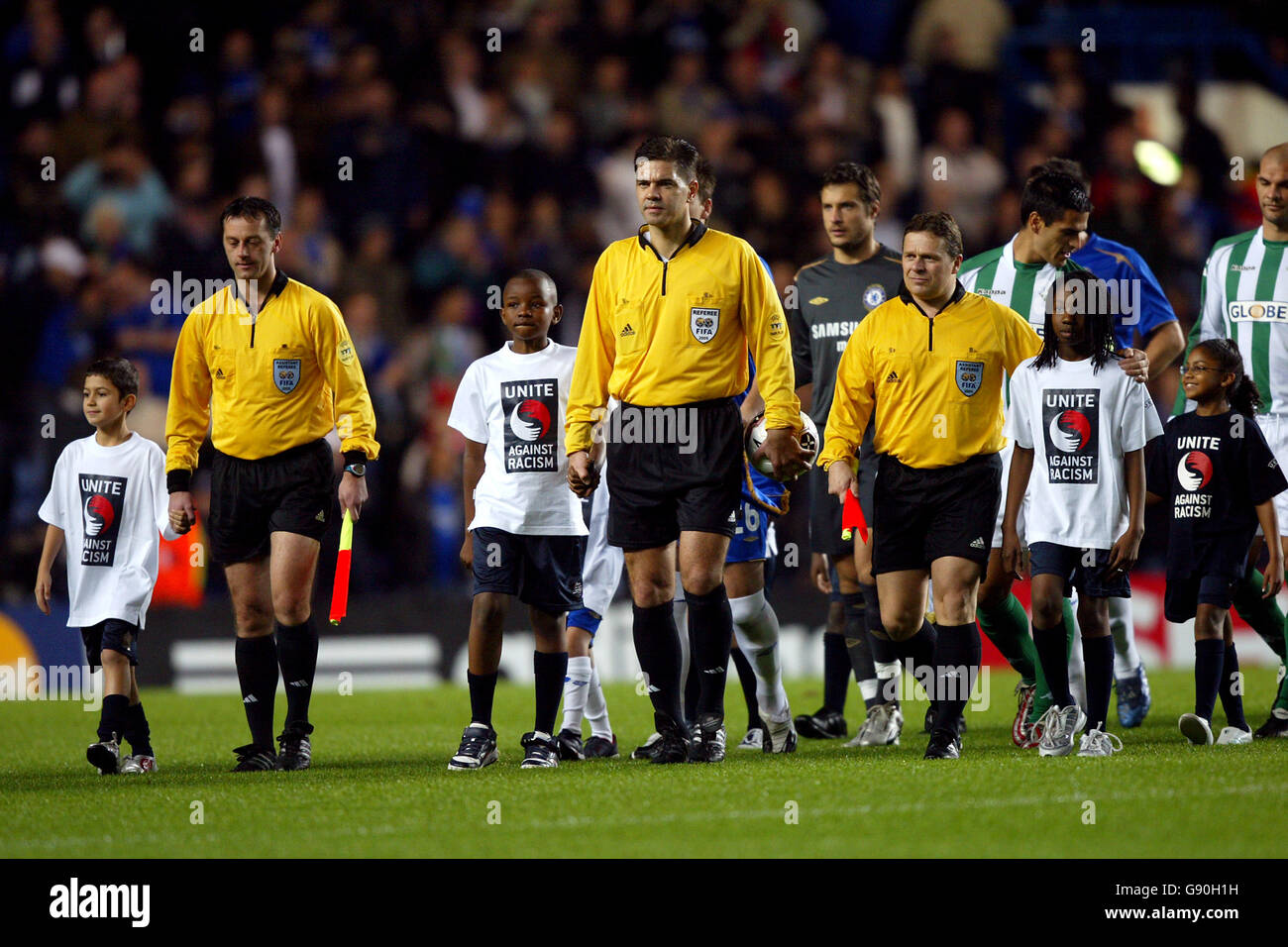 Soccer - UEFA Champions League - Group G - Chelsea v Real Betis - Stamford Bridge. Referee Terje Hauge (c) and his assistants Arild Sundet and Steinar Holvik lead the teams out Stock Photo