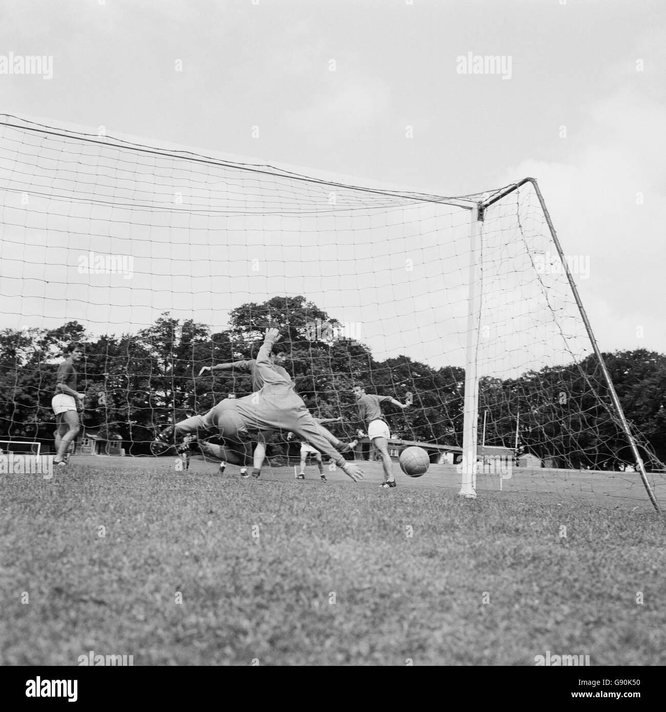 France goalkeeper Marcel Aubour is beaten by a shot from Philippe Gondet during training Stock Photo