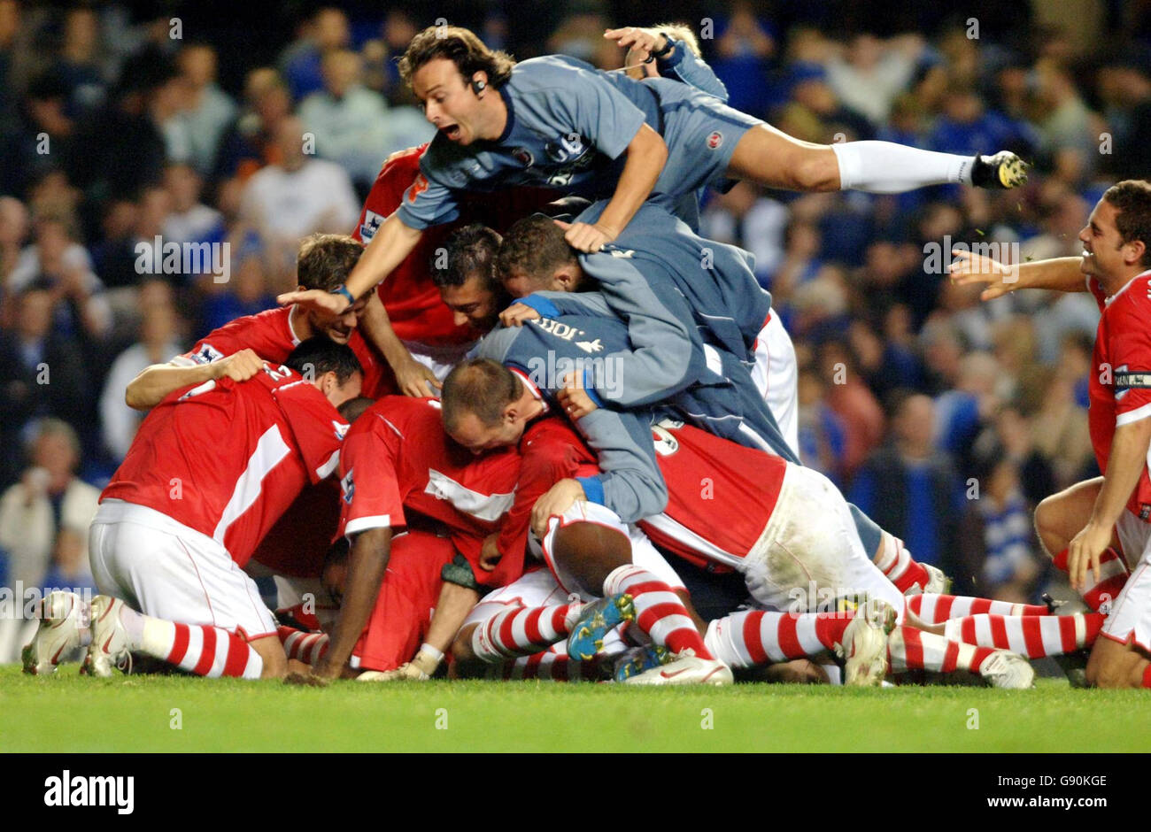 Charlton players celebrate after Bryan Hughes (hidden) scores the ...