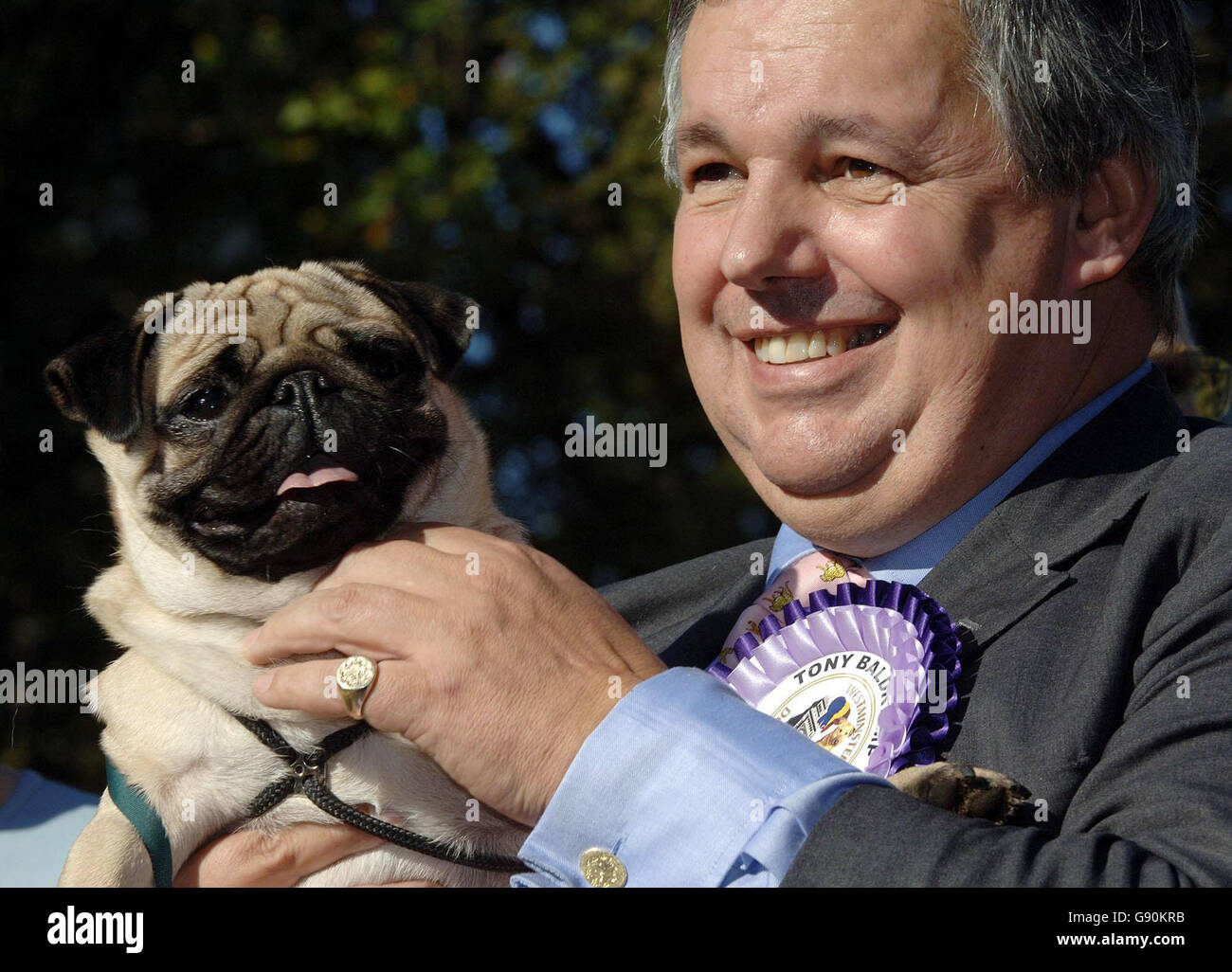 Conservative MP for Banbury, Tony Baldry in central London, Thursday 27 October, 2005, with his 18-month-old pug Torres, the newly-crowned Westminster Dog of the Year. Now in its 13th year the competition run by the Dogs Trust and Kennel Club aims to promote responsible dog ownership and highlight the special bond between dogs and their owners and was keenly contested by 17 candidates this year. See PA story ANIMALS Westminster. PRESS ASSOCIATION photo. Photo credit should read: Matthew Fearn/PA. Stock Photo