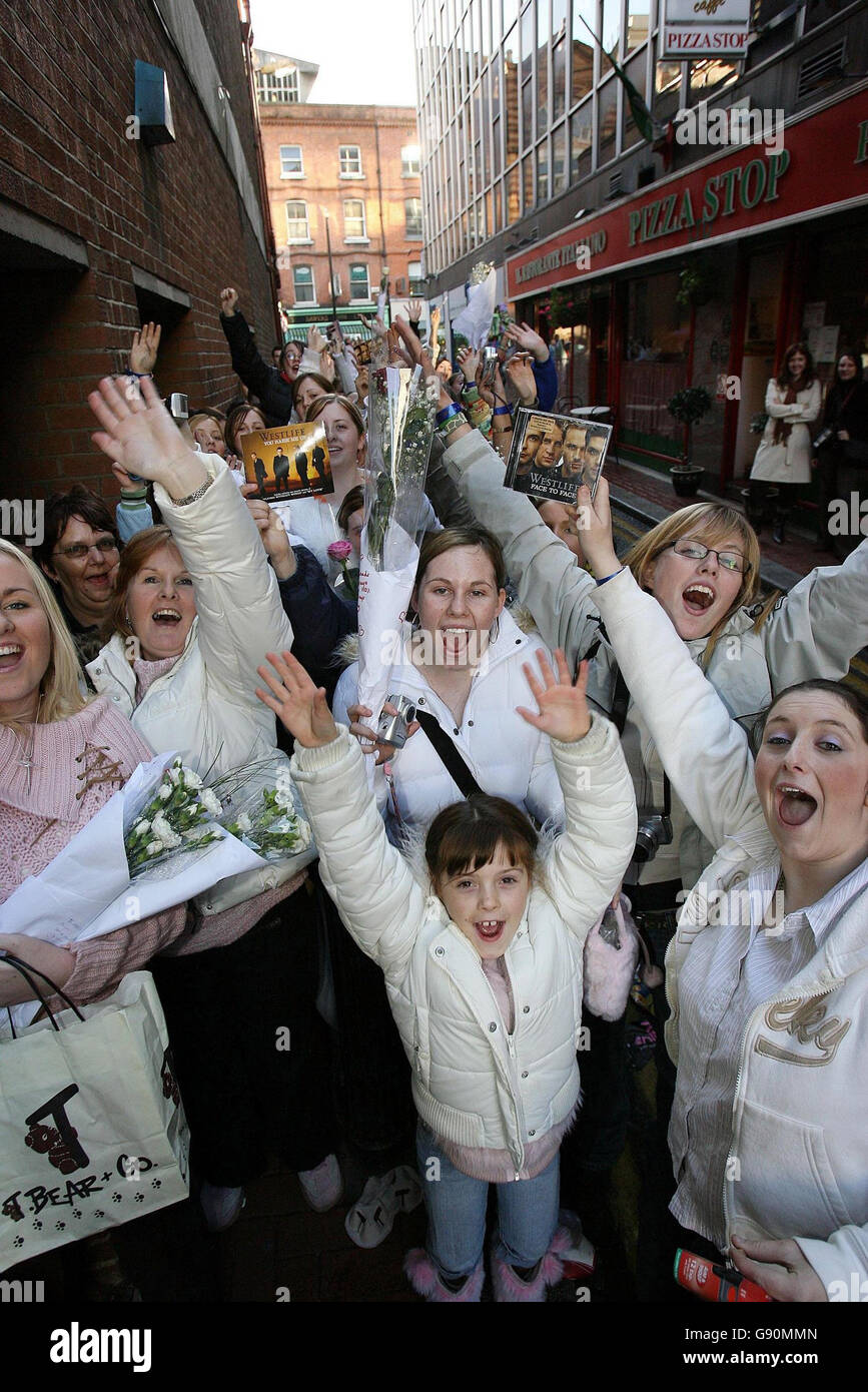 Fans of pop group Westlife queue in the cold outside Dublin's HMV, Friday October 28, 2005, to see the band as they promot their new album Face to Face in the city. Since they were formed by manager Louis Walsh seven years ago, Westlife have sold over 35 million albums worldwide with six multi-platinum albums in the UK and 12 UK number ones. See PA Story SHOWBIZ Westlife. PRESS ASSOCIATION Photo. Photo credit should read: Niall Carson/PA Stock Photo