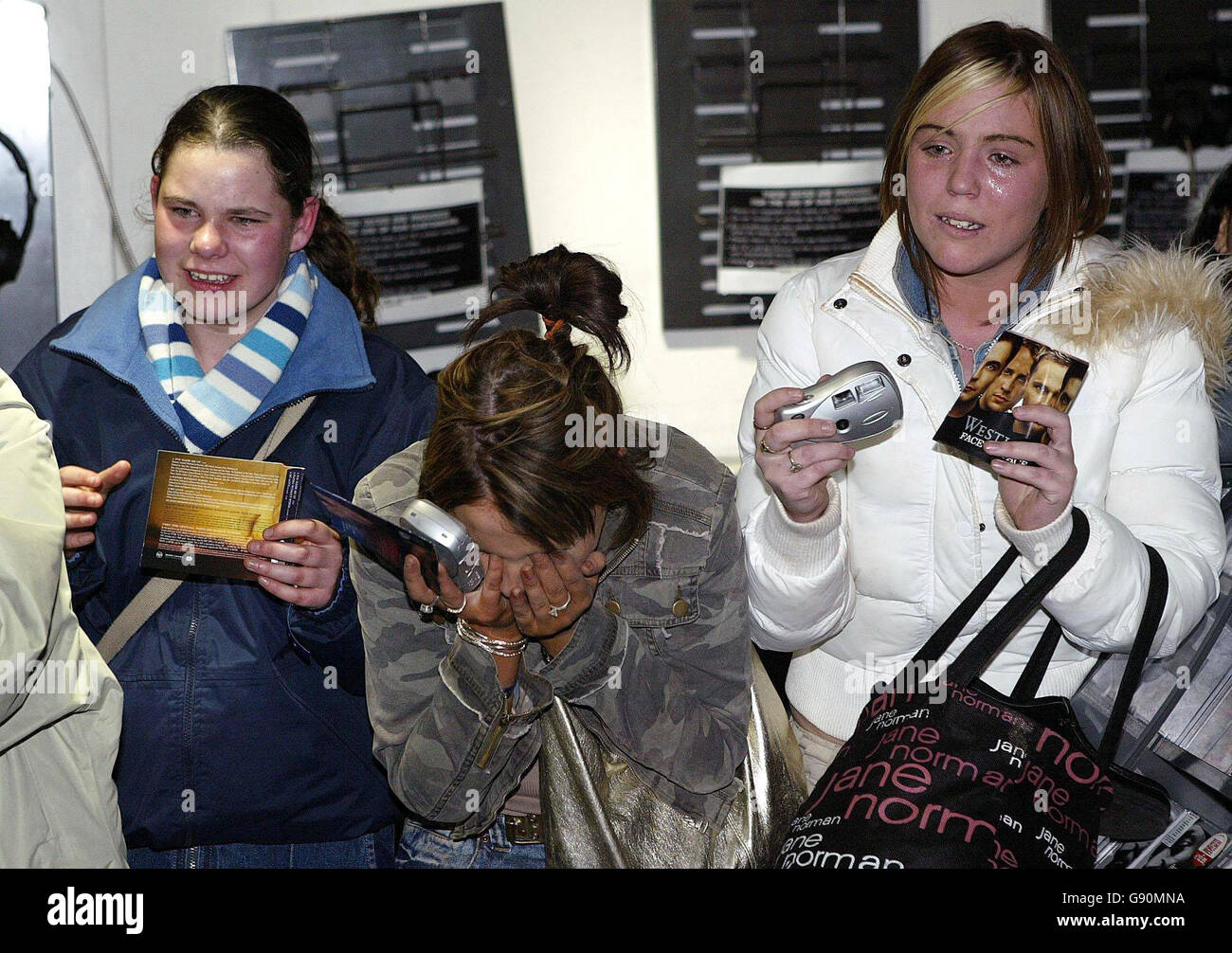 Screaming fans react to the arrival of pop group Westlife as they promote their new album Face to Face in the city, Friday October 28, 2005. Since they were formed by manager Louis Walsh seven years ago, Westlife have sold over 35 million albums worldwide with six multi-platinum albums in the UK and 12 UK number ones. See PA Story SHOWBIZ Westlife. PRESS ASSOCIATION Photo. Photo credit should read: Niall Carson/PA Stock Photo