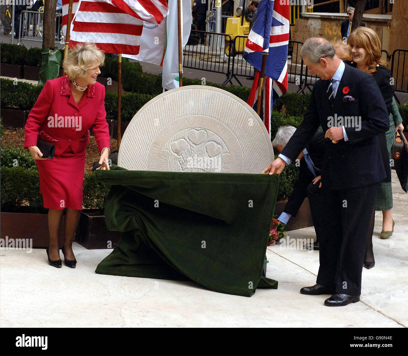The Prince of Wales with his wife the Duchess of Cornwall, unveil a stone plaque in the British Memorial Gardens in Hanover Square New York City, Tuesday November 1, 2005. The garden is a living memorial to the 67 British victims of the terrorist attack on the World Trade Centre, on the September 9, 2001. The Prince of Wales and the Duchess of Cornwall arrived in the city at the start of a week-long tour of the USA, which will take them from New York to Washington and on to San Francisco. See PA story ROYAL Charles. PRESS ASSOCIATION Photo. Photo credit should read: John Stillwell/PA. Stock Photo