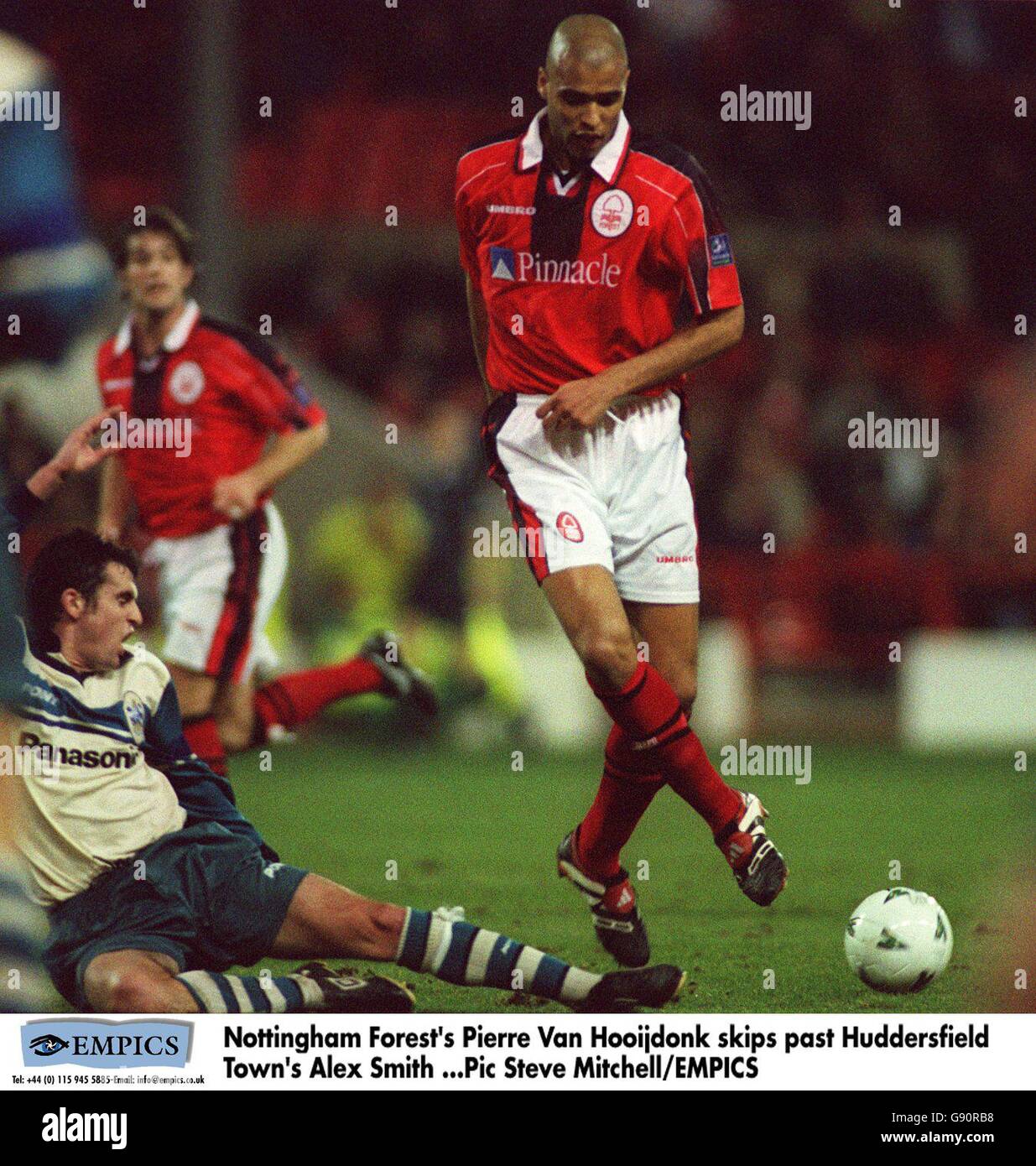 Soccer - Nationwide League Division One - Nottingham Forest v Huddersfield Town. Nottingham Forest's Pierre Van Hooijdonk skips past Huddersfield Town's Alex Smith Stock Photo