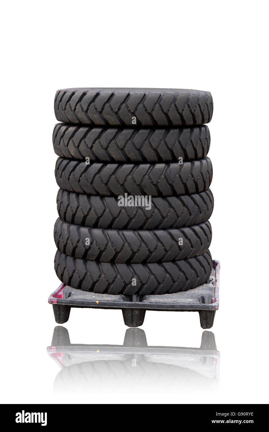 Tires on a plastic pallet isolated on white background. This have clipping paths Stock Photo