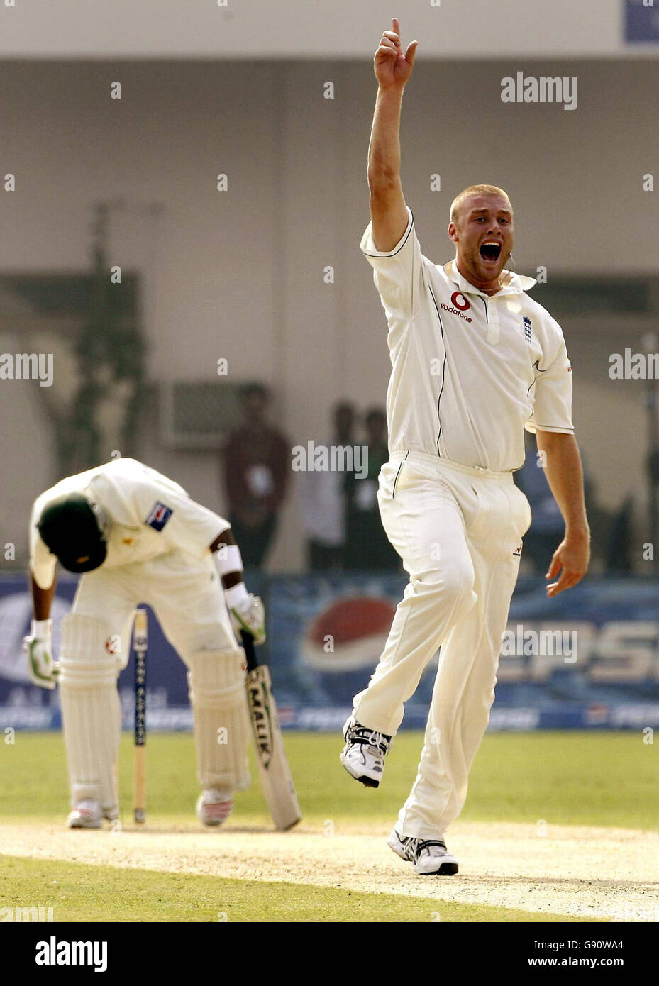 England's Andrew Flintoff celebrates trapping Pakistan's Shoaib Malik lbw during the first day of the first Test match at the Multan Cricket Stadium in Multan, Pakistan, Saturday November 12, 2005. See PA story CRICKET England. PRESS ASSOCIATION Photo. Photo credit should read: Gareth Copley/PA. Stock Photo