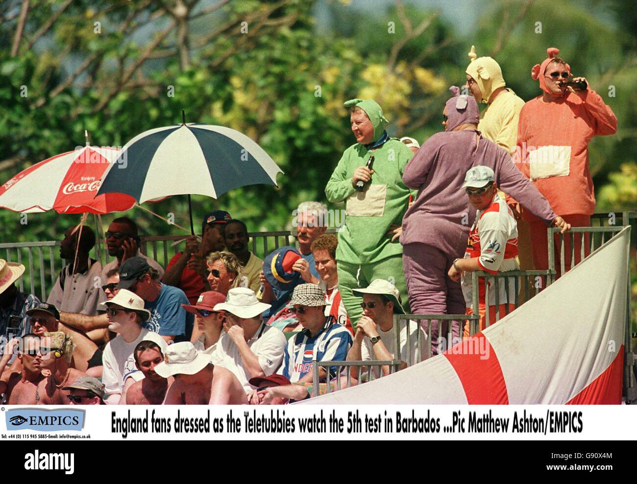 Cricket - Fifth Test - West Indies v England - Barbados - First Day. England fans dressed as the Teletubbies watch the fifth test Stock Photo