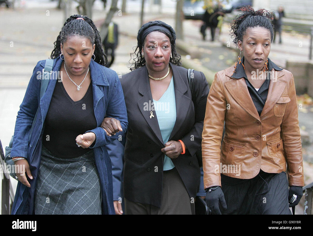Gee Verona-Walker (centre), mother of Anthony Walker, arrives at Liverpool Crown Court with family members, Tuesday November 15 2005, where the two men accused of bludgeoning Anthony Walker to death with an axe go on trial. Paul Taylor and Michael Barton, aged 20 and 17, allegedly attacked the 18-year-old in July as he walked through Huyton, Merseyside, with his girlfriend and cousin. See PA story COURTS Axe. PRESS ASSOCIATION Photo. Photo credit should read: Martin Rickett/PA Stock Photo