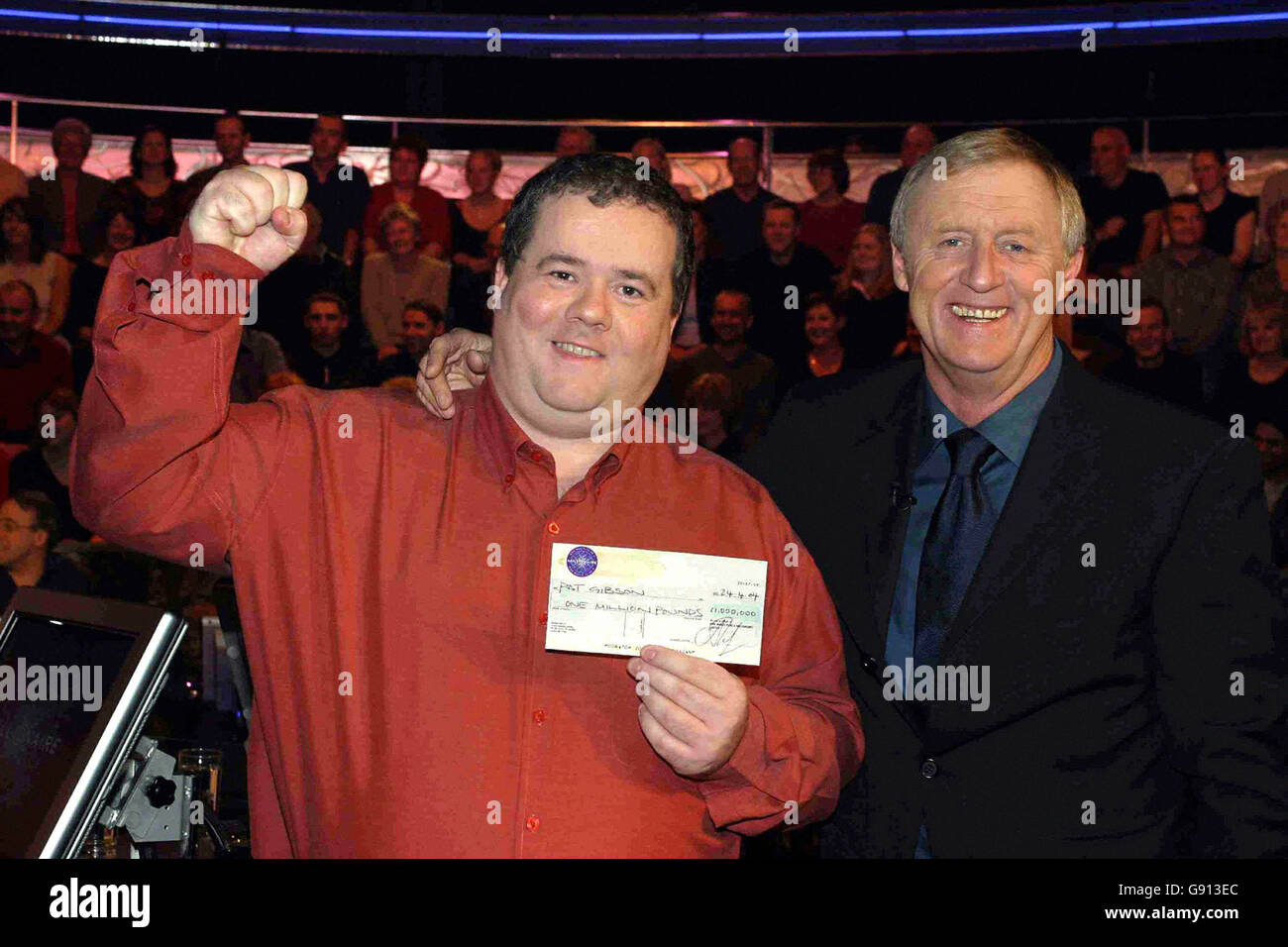FILE PICTURE dated 24 April 2004 showing computer programmer Pat Gibson being congratulated by host Chris Tarrant after becoming the fourth and youngest 1 million winner on the quiz show Who Wants To Be A Millionaire? The quiz expert was celebrating today after also winning Mastermind. Pat Gibson won the coveted crystal bowl last night without passing on a single question. London, Wednesday 9 November 2005. See PA story SHOWBIZ Mastermind. PRESS ASSOCIATION Photo. Photo credit should read: PA/CELADOR/ITV Stock Photo