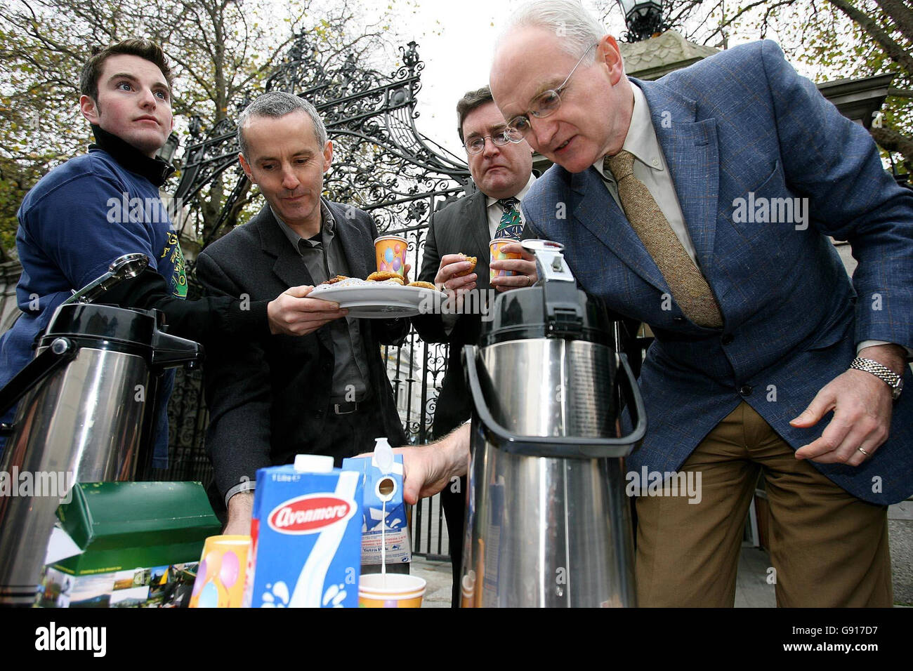 Green Party TD's r-l John Gormley,Dan Boyle and Ciaran Cuffe with Ewan Kelly of Young Greens (left) outside Leinster House Dublin Wednesday Nov 23 2005 having a cup of Fair Trade Tea and Biscuits.The Young Greens were launching 'Fair Trade Nation' calling on all State Organisations to use Fair Trade Products. See PA Story POLITICS Free Trade. PRESS ASSOCIATION PHOTO. Photo credit should read Julien Behal./PA Stock Photo
