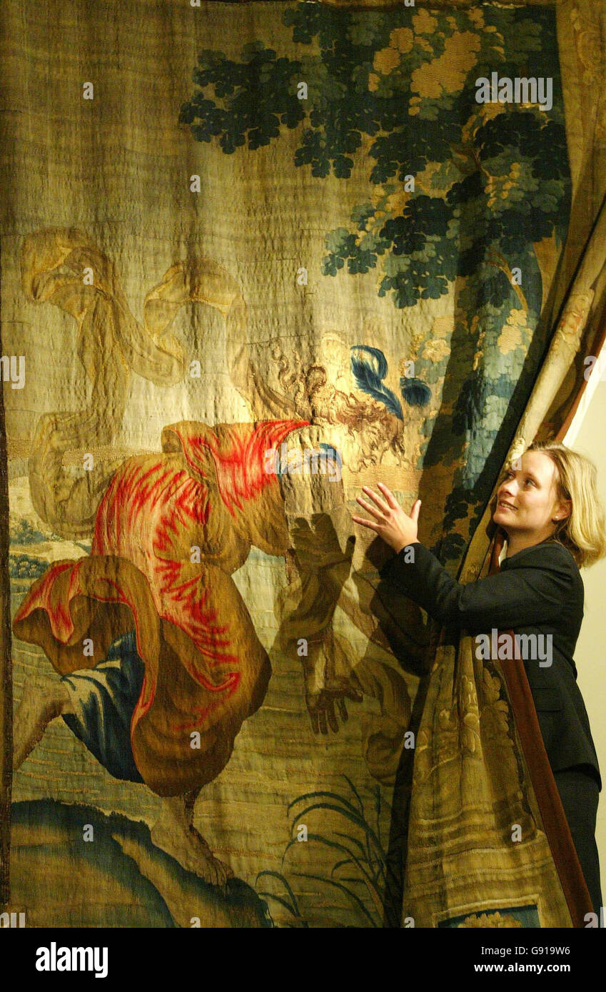 Lyon & Turnbull staff member Victoria Crake takes a close look at one of a set of tapestries belonging to the Duke of Hamilton in Edinburgh, Thursday 1 December, 2005. The tapestries, which were historically hung in the Palace of Holyrood House, will be auctioned on 9th December in Edinburgh. PRESS ASSOCIATION Photo. Photo credit should read: David Cheskin/PA Stock Photo