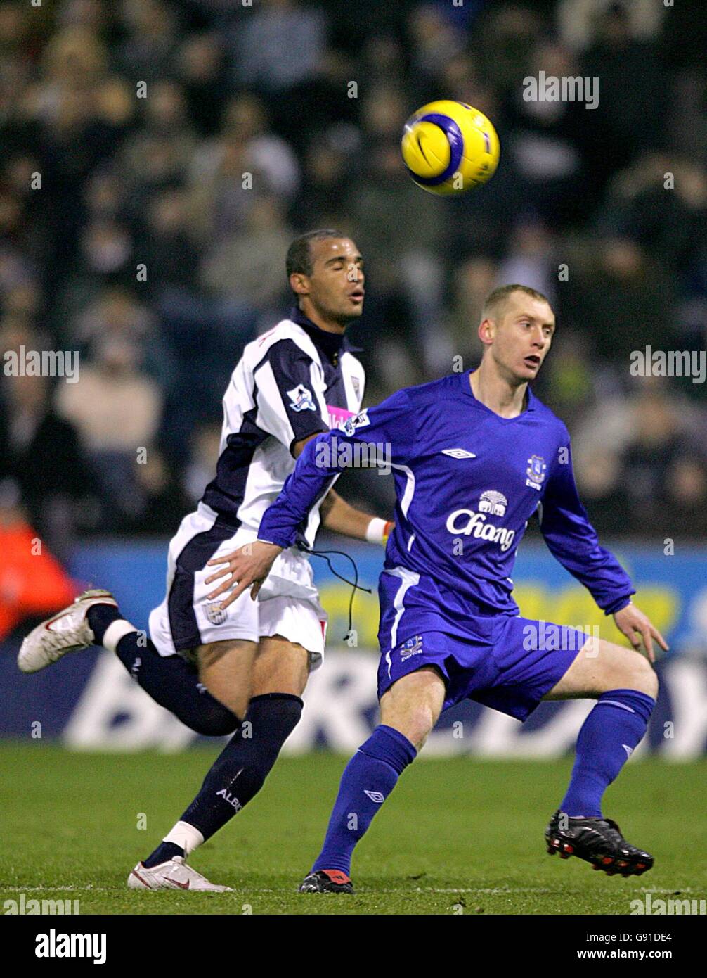 West Bromwich Albion's Neil Clement and Everton's Tony Hibbert battle for the ball Stock Photo