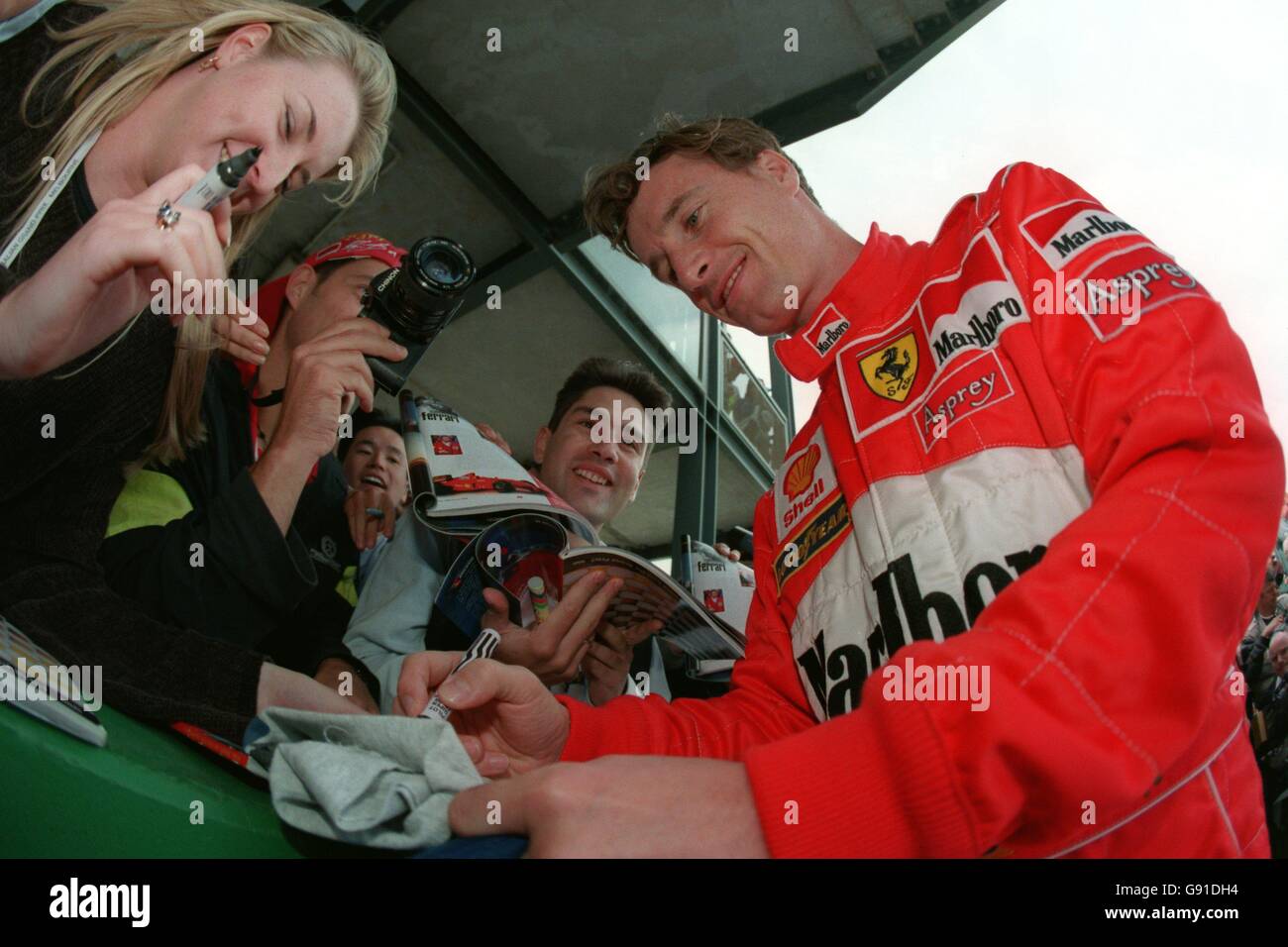 Formula One Motor Racing Australian Grand Prix. Eddie Irvine signs
