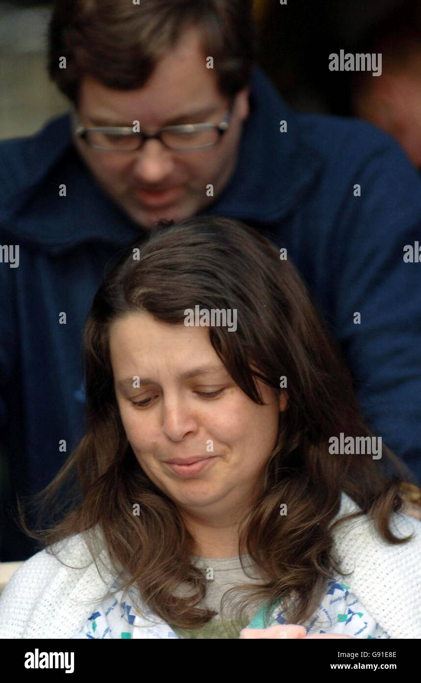 WPC Teresa Milburn, who was wounded in the shooting in Bradford in which colleague WPC Sharon Beshenivsky was killed, is pushed in a wheelchair by her husband Chris after leaving Bradford Hospital in West Yorkshire, Sunday November 20, 2005. Six people arrested in connection with the shooting were held in a series of raids across London yesterday, less than 24 hours after 38-year-old Pc Beshenivsky was gunned down by robbers in Bradford city centre. See PA story POLICE Officer. PRESS ASSOCIATION PHOTOS. Photo credit should read: John Giles/PA Stock Photo