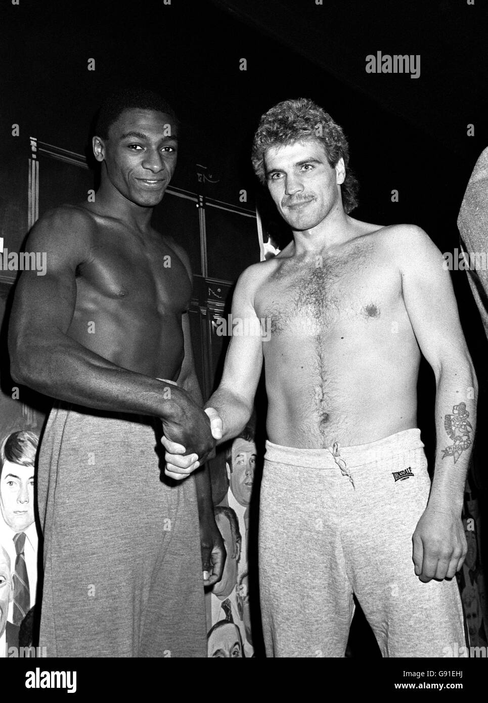 Cordial greetings between Sheffield boxer Herol 'Bomber' Graham (left) and Belgium's Jose Seys at the weigh-in. Stock Photo