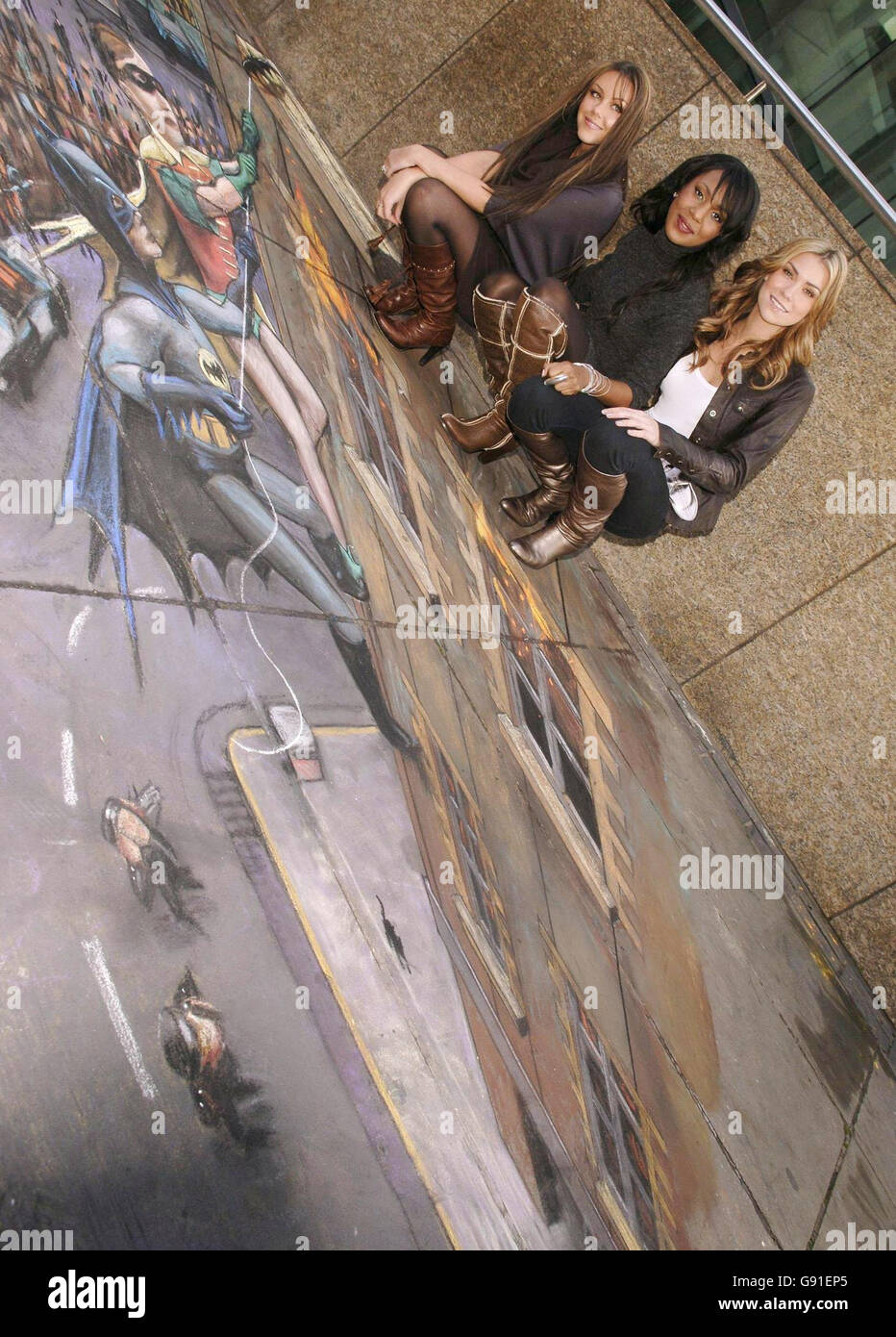 The girls from Liberty X during the launch of T-Mobile's 'Web 'n' Walk Sidekick Device', posing next to a pavement painting (by artist Julian Beever) of Batman and Robin, near the entrance to the Millennium Bridge, central London, Monday 21 November 2005. PRESS ASSOCIATION Photo. Photo credit should read: Yui Mok / PA Stock Photo