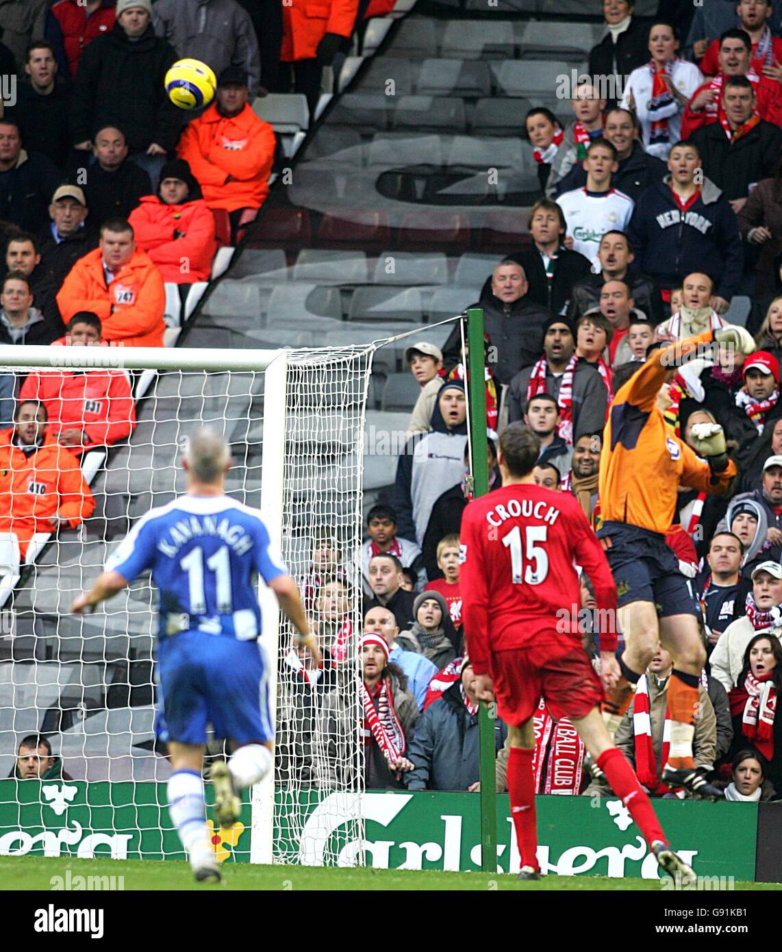 Soccer - FA Barclays Premiership - Liverpool v Wigan Athletic - Anfield. Liverpool's Peter Crouch lobs Wigan Athletic's goalkeeper Michael Pollitt to score his second goal Stock Photo