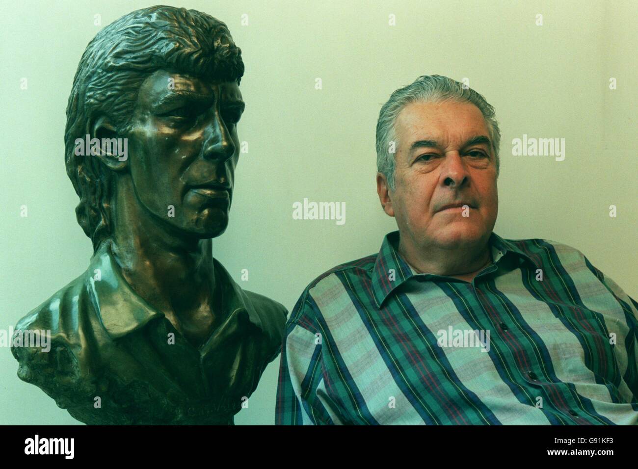Dario Escobar poses with the bust of his son, Andres Escobar Stock Photo