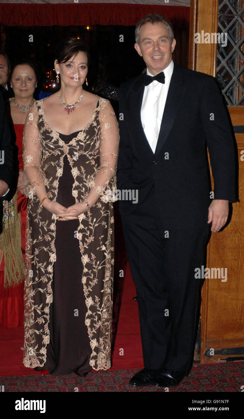 Prime Minister Tony Blair and his wife Cherie arrive at a reception of