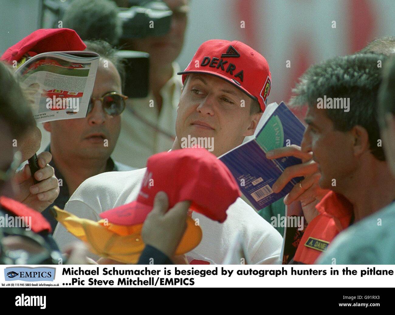 Formula One Motor Racing - Monaco Grand Prix - Practice. Michael Schumacher is besieged by autograph hunters in the pitlane Stock Photo
