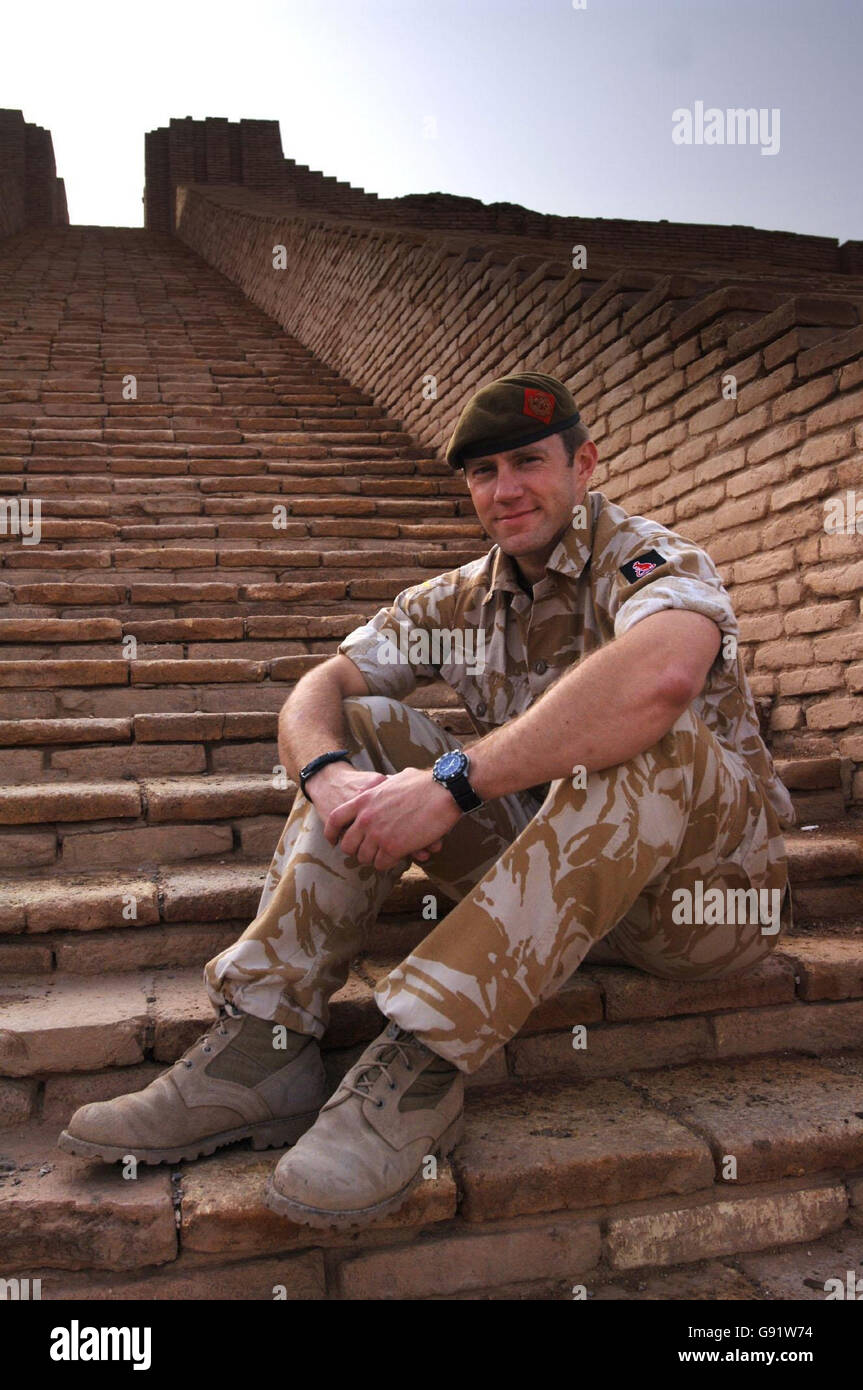 Captain Rich Oakes of 1st Battlion The King's Own Royal Border Regiment sits on the steps of the ancient temple the Ziggurat near Nasiriyah, Iraq, Friday 17 December, 2005. The temple, which was built in 2112 BC to worship Namma the moon god, is adjacent to the ancient city of Ur where it is believed that the biblical character Abraham lived. Capt. Oakes and his regiment, whose headquarters are inCumbria, are involved with training the Iraqi army at nearby Tallil. PRESS ASSOCIATION Photo. Photo credit should read: Matthew Fearn/PA Stock Photo