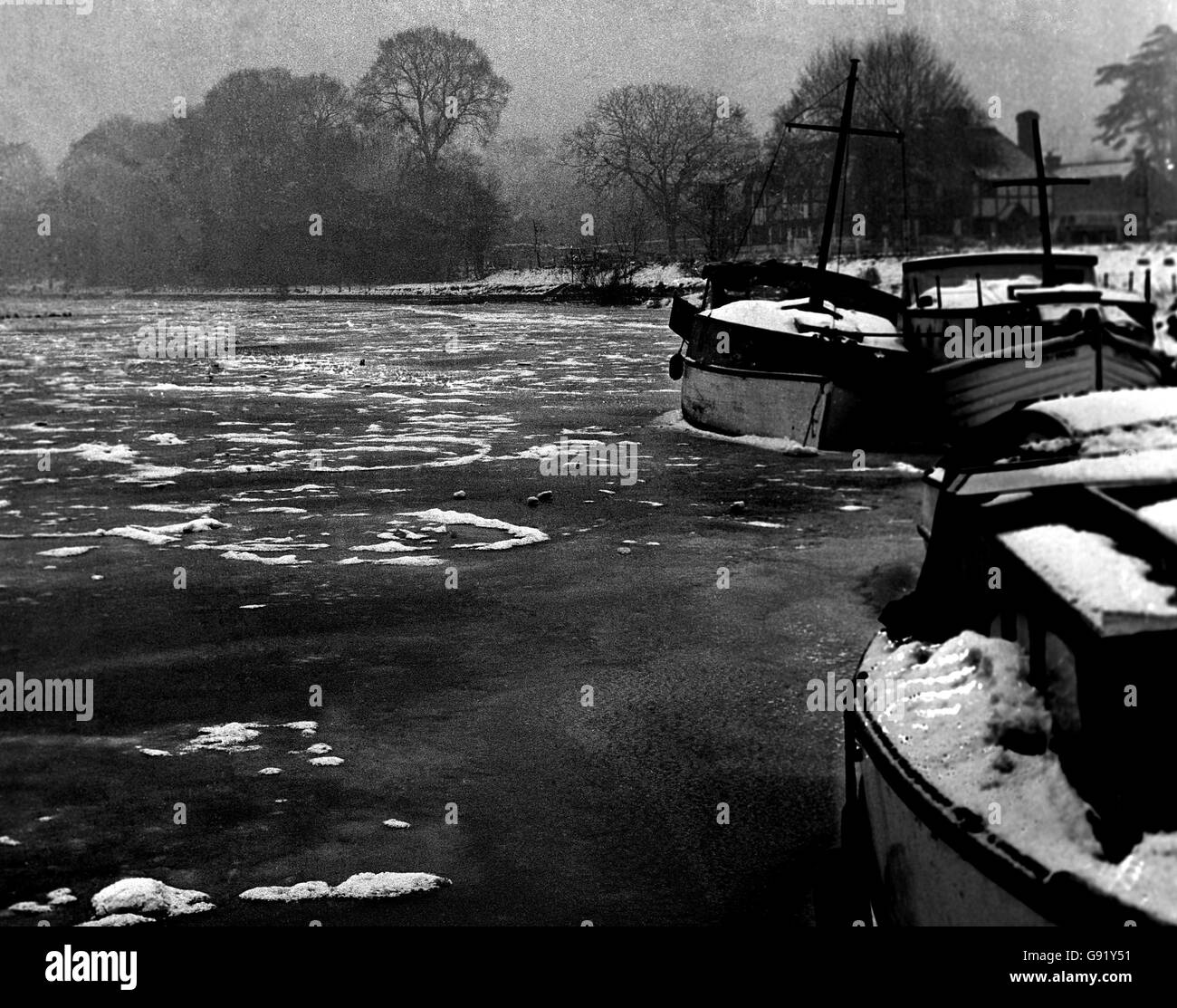 Idler II and Witch of Endor seem to be almost huddling together for warmth as they sit, frozen solid in the River Thames. The Thames was frozen from bank-to-bank in some places. Stock Photo