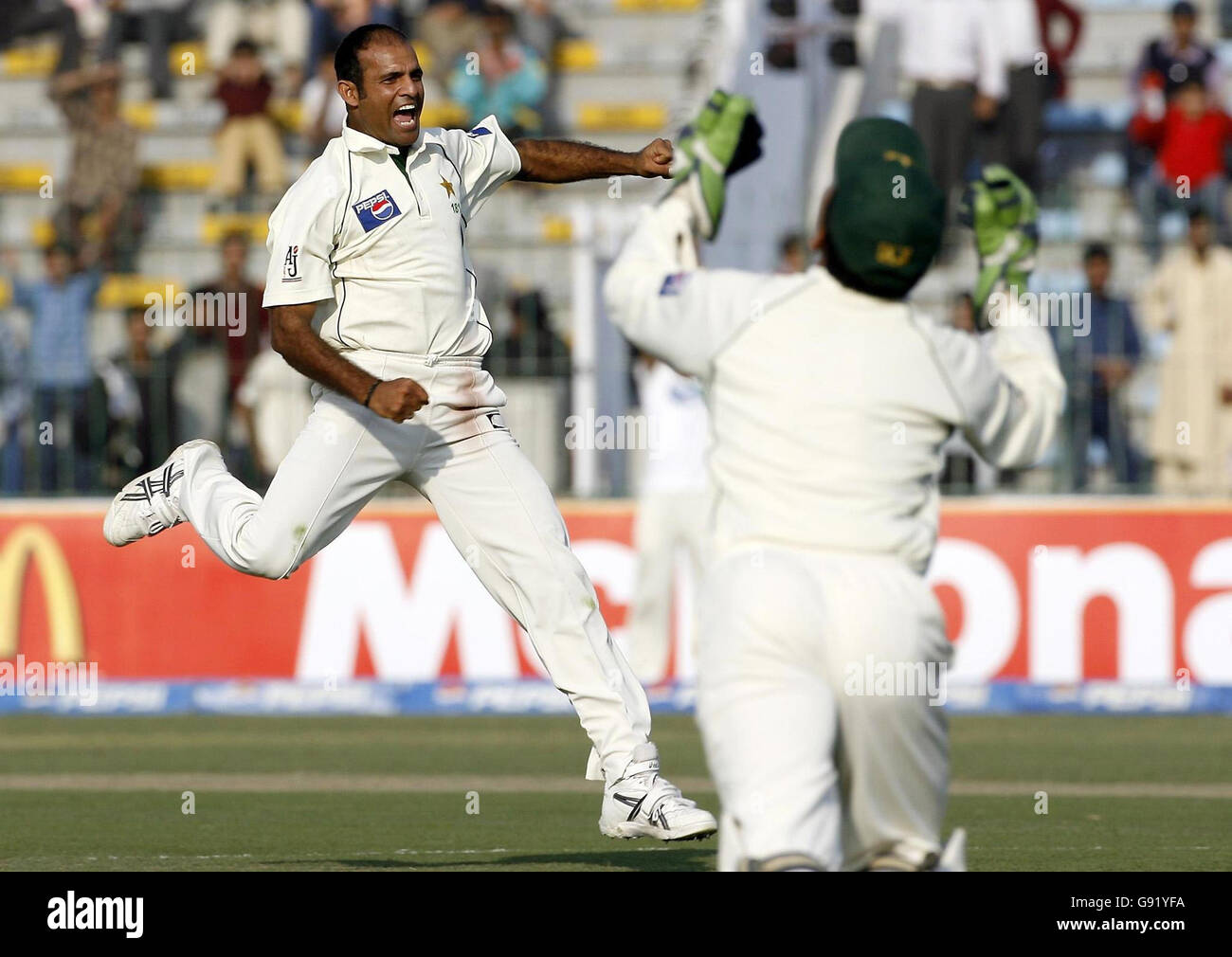 Pakistan's Rana Naveed-ul-Hassan celebrates taking the wicket of ...